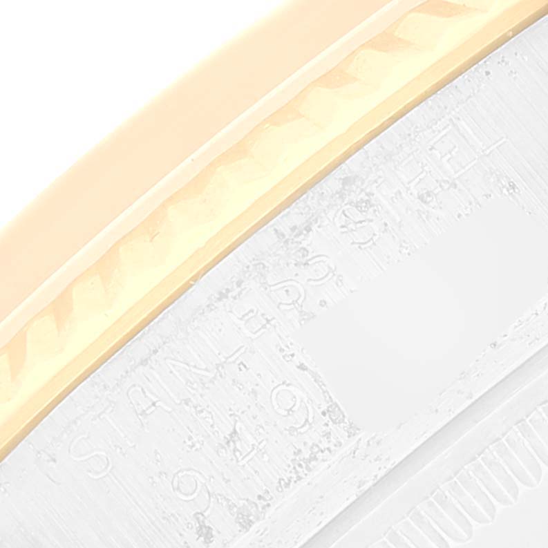 The image shows a close-up angle of the bezel and part of the case of a Rolex Datejust 16013 Men's Steel and Gold (two tone) White Dial 16013 Men's Steel and Gold (two tone) White Dial watch.