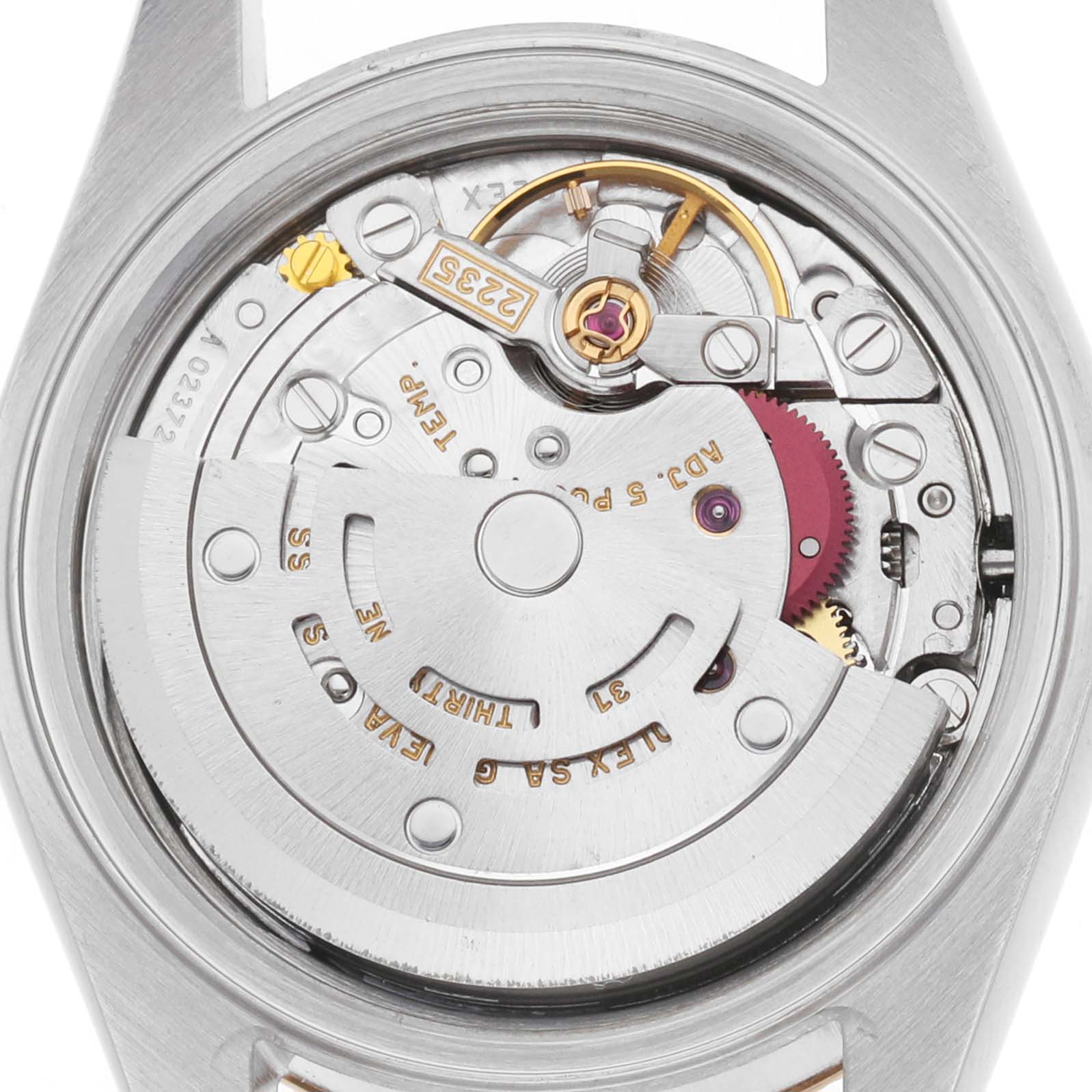The image shows the movement of a Rolex Datejust 79173 Women's Steel and Gold (two tone) White Dial watch from a rear angle, highlighting the rotor and internal mechanics.