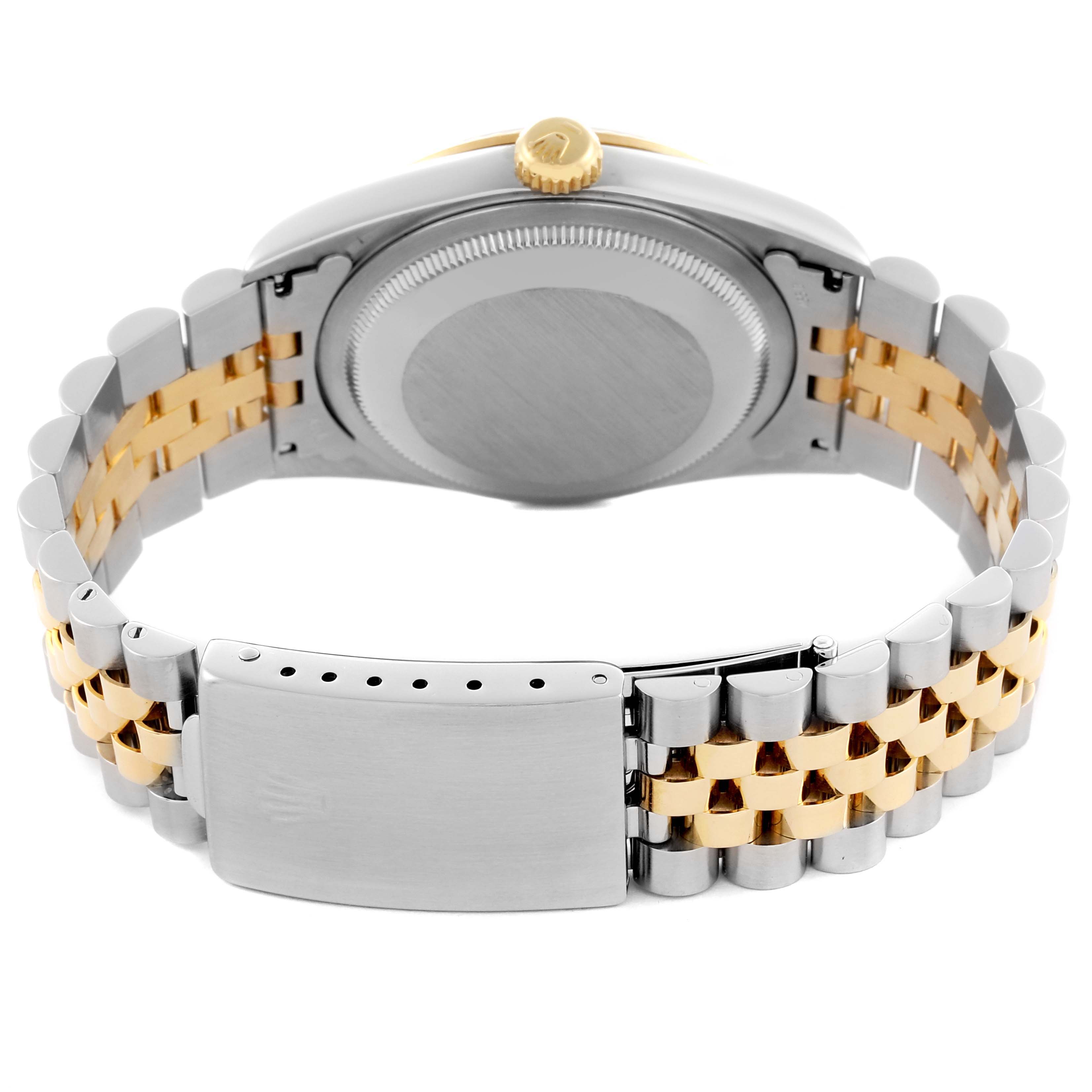 The image shows the Rolex Datejust 16233 Men's Steel and Gold (two tone) White Dial 16233 Men's Steel and Gold (two tone) White Dial's side and back, highlighting the metal and gold bracelet and clasp.