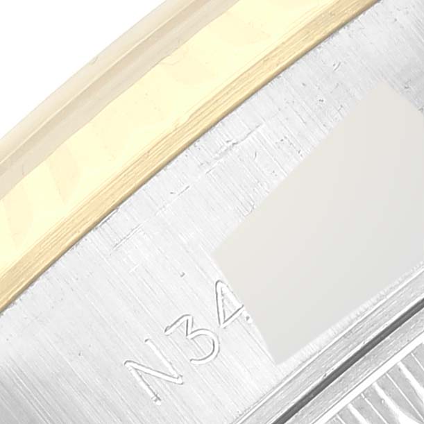 This is a close-up shot of the case edge for a Rolex Datejust 69173 Women's Steel and Gold (two tone) White Dial 69173 Women's Steel and Gold (two tone) White Dial.