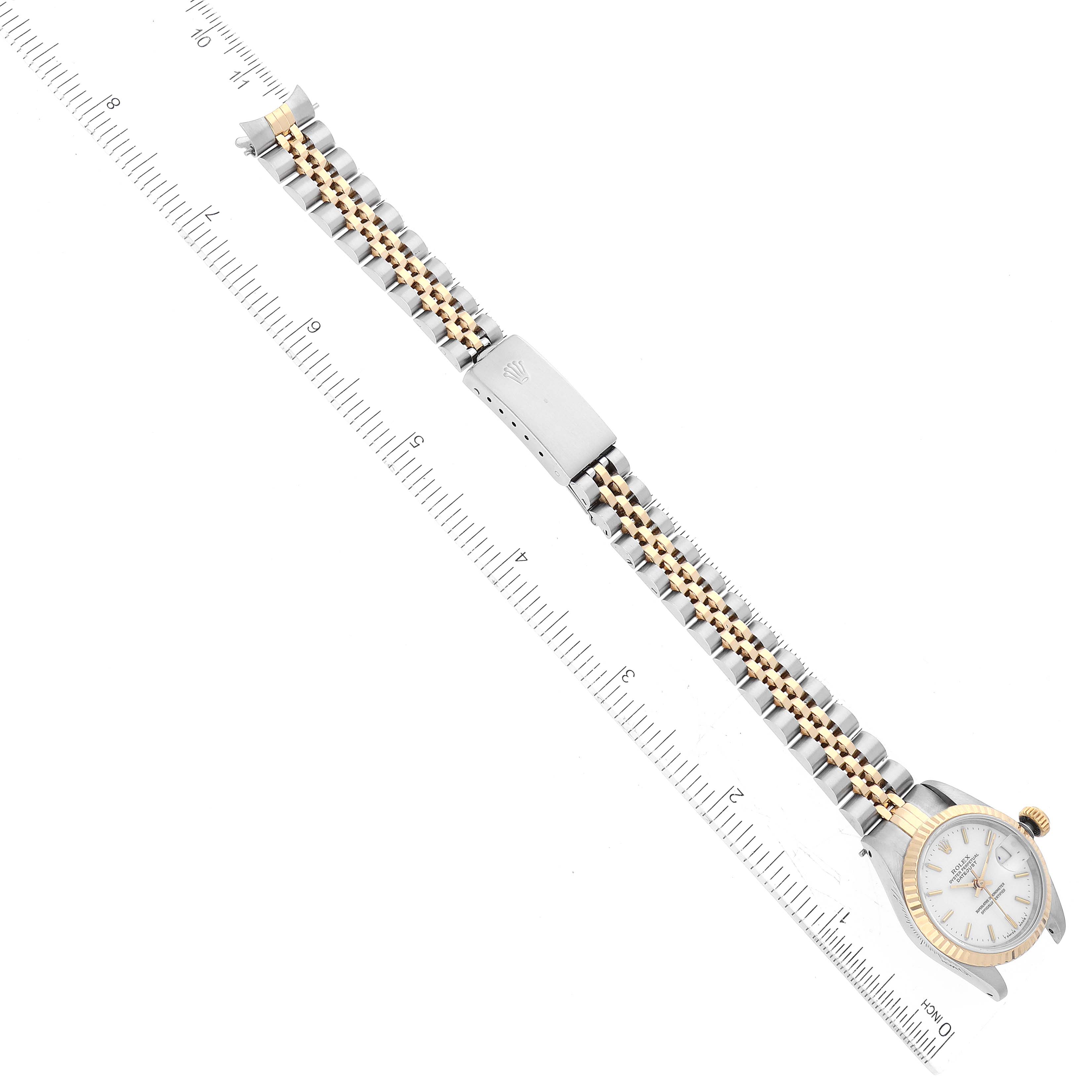 The image shows a full-length view of a Rolex Datejust 69173 Women's Steel and Gold (two tone) White Dial 69173 Women's Steel and Gold (two tone) White Dial watch, including the face, bezel, and bracelet, alongside a ruler for scale.