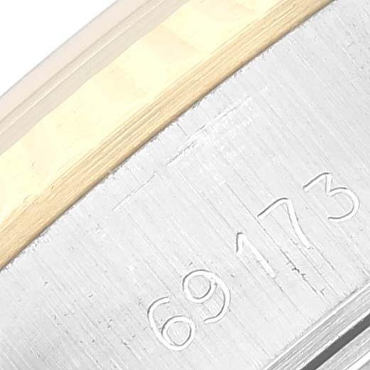 This close-up image shows the engraved model number "69173" on the case of a Rolex Datejust 69173 Women's Steel and Gold (two tone) White Dial 69173 Women's Steel and Gold (two tone) White Dial watch.