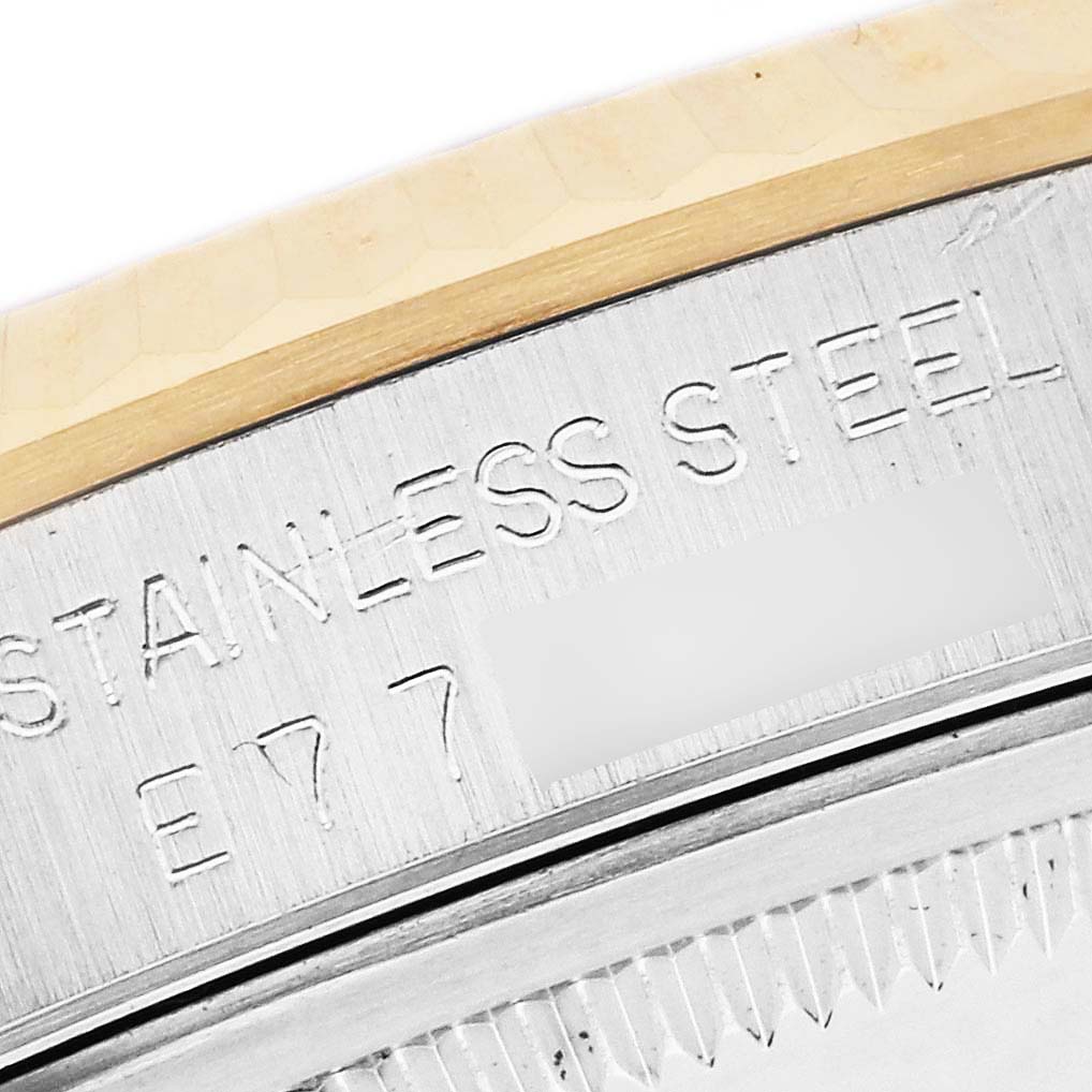 The image shows a close-up of the Rolex Datejust 16233 Men's Steel and Gold (two tone) White Dial 16233 Men's Steel and Gold (two tone) White Dial watch, highlighting the engraved stainless steel case back.