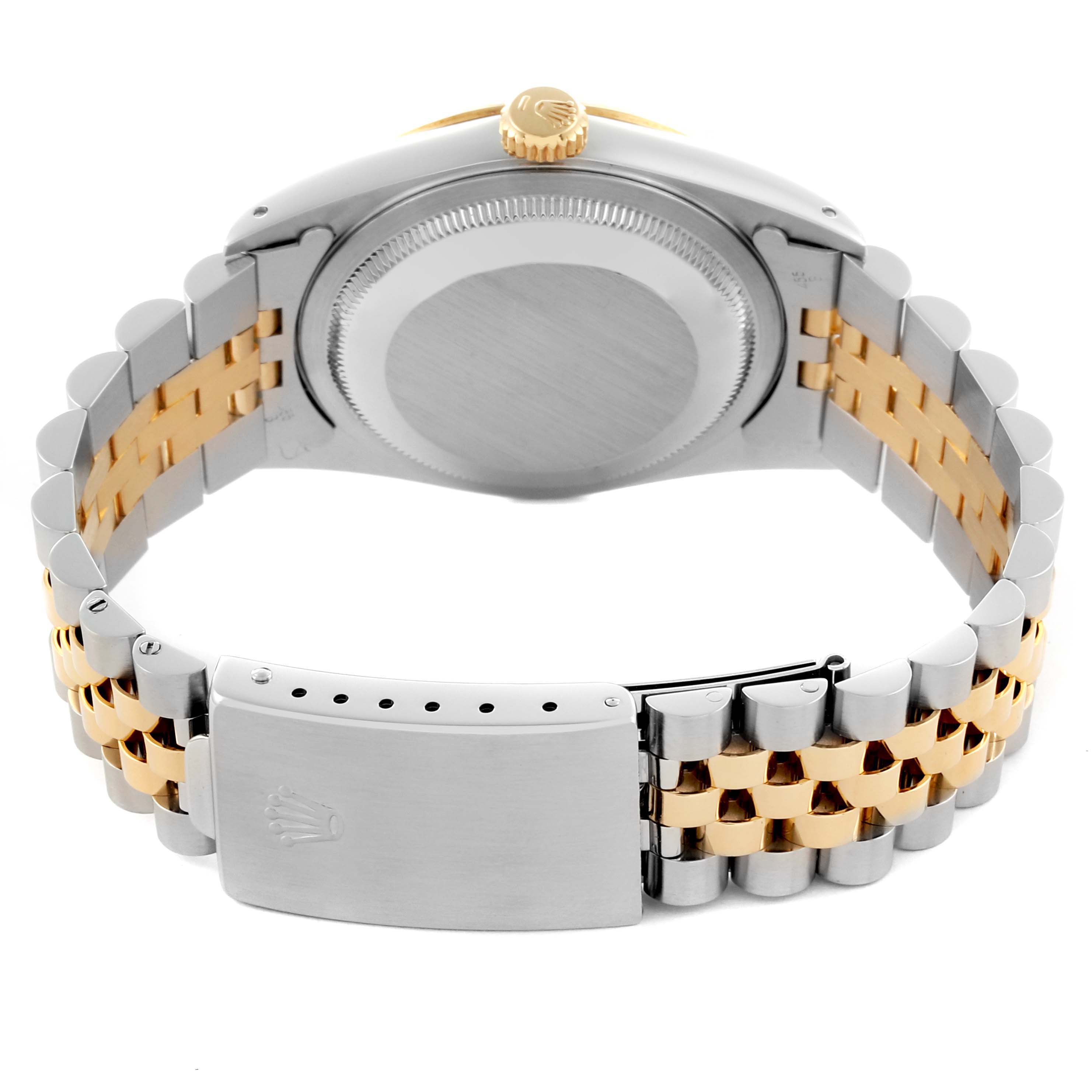 The image shows the back and clasp of a Rolex Datejust 16233 Men's Steel and Gold (two tone) White Dial 16233 Men's Steel and Gold (two tone) White Dial, highlighting its two-tone bracelet and case back.