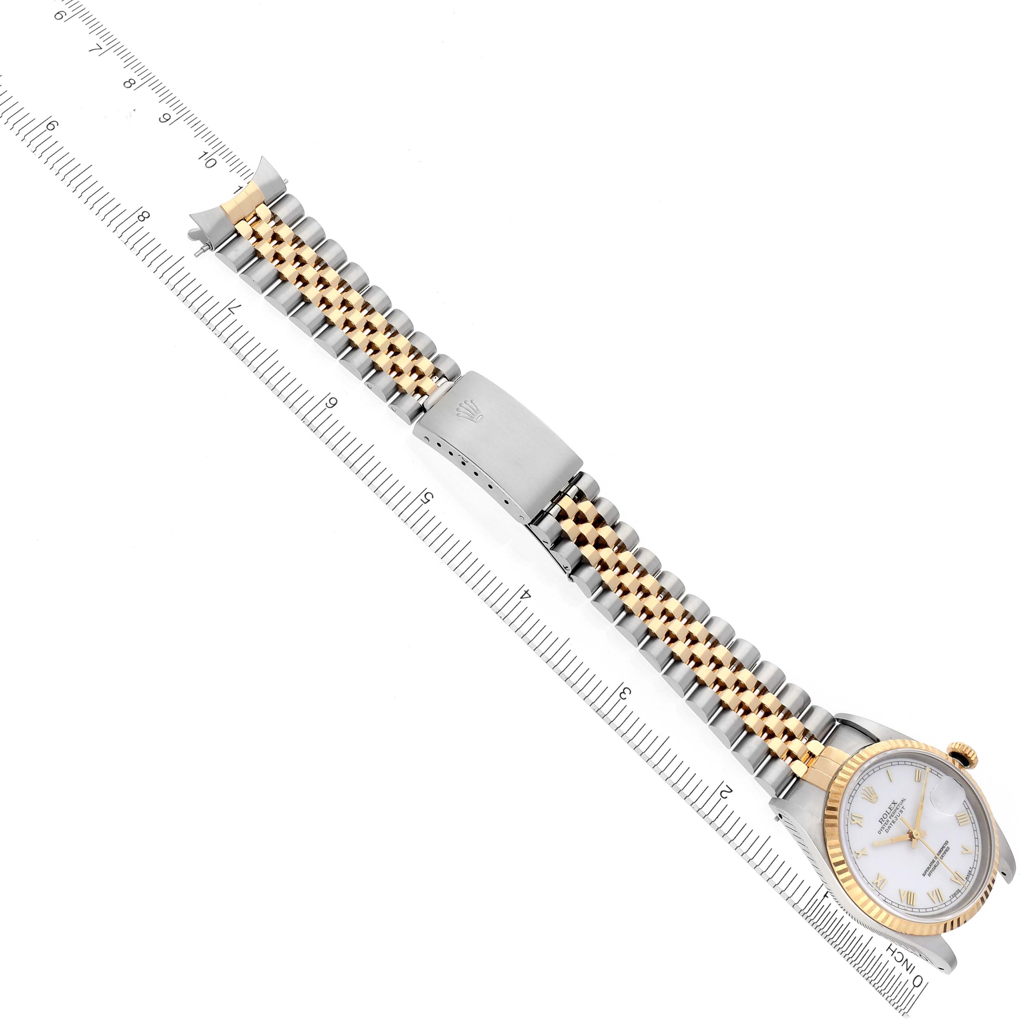 The Rolex Datejust 16233 Men's Steel and Gold (two tone) White Dial 16233 Men's Steel and Gold (two tone) White Dial watch is shown from a top-down angle, featuring its full band and the face with a gold and silver color scheme.