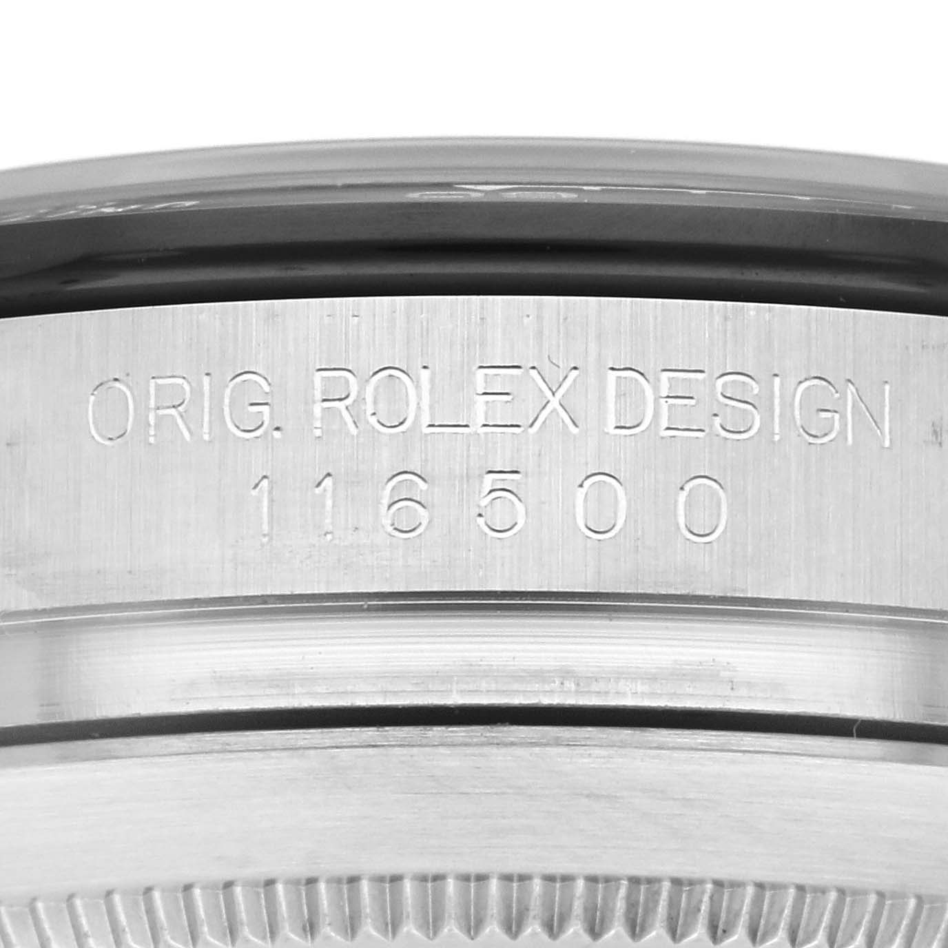 The image shows a close-up of the side of a Rolex Daytona 116500LN Men
s Stainless Steel Black Dial 116500LN Men
s Stainless Steel Black Dial, focusing on the model engraving "ORIG. ROLEX DESIGN 116500."
