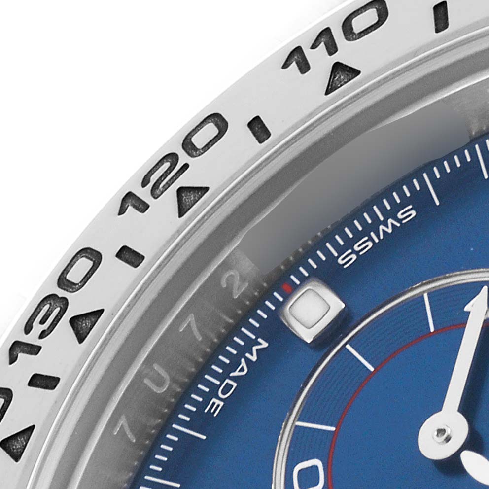 The image shows a close-up of the bezel and part of the dial of the Rolex Daytona 116509 Men's White Gold Blue Dial 116509 Men's White Gold Blue Dial watch, highlighting the tachymetric scale.
