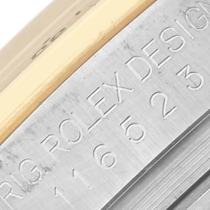 The image shows an engraved side view of the Rolex Daytona 116523 Men's Steel and Gold (two tone) Silver Dial 116523 Men's Steel and Gold (two tone) Silver Dial's case, highlighting the branding and model number.