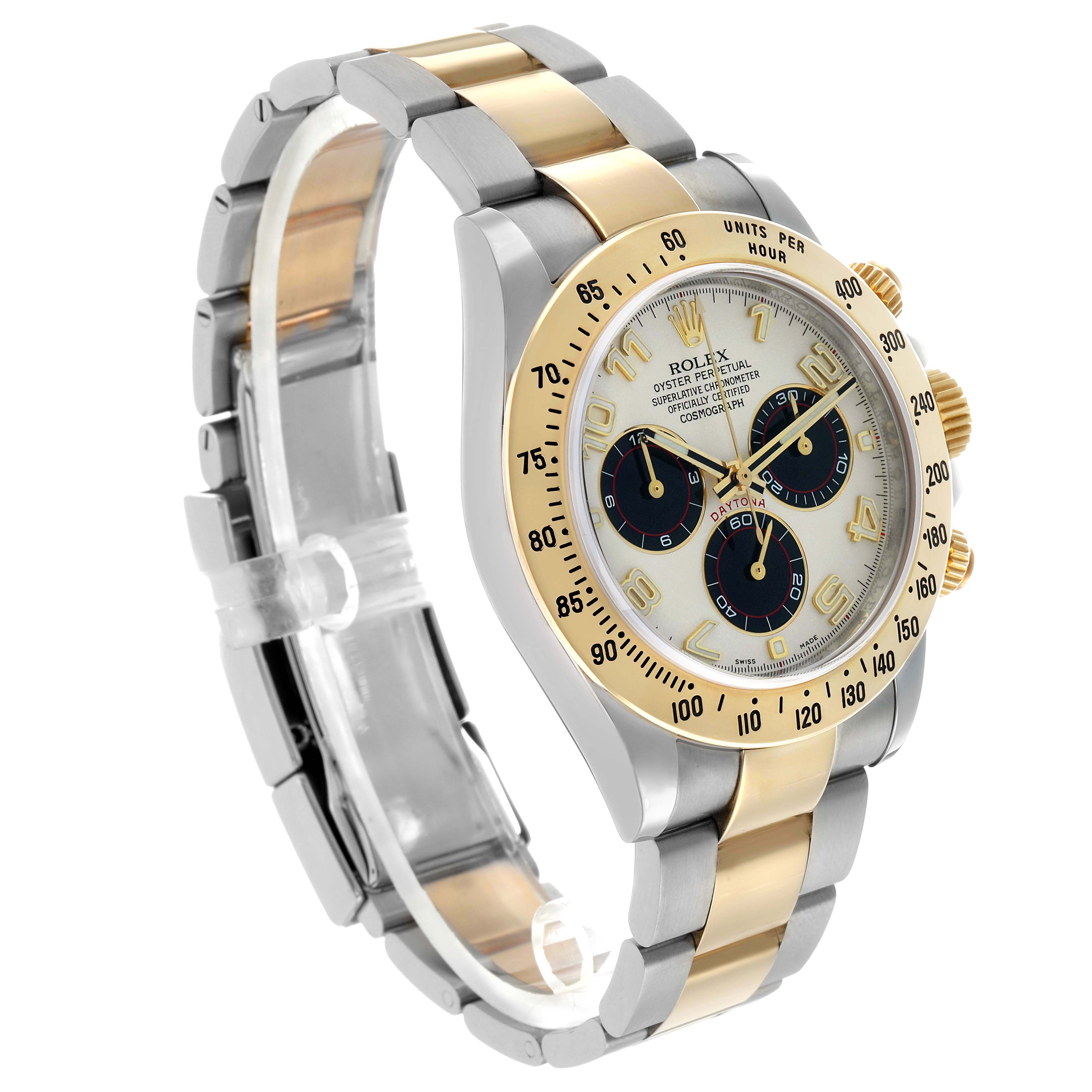 The Rolex Daytona 116523 Men's Steel and Gold (two tone) Silver Dial is shown at an angled side view, highlighting the bezel, dial, and two-tone bracelet.