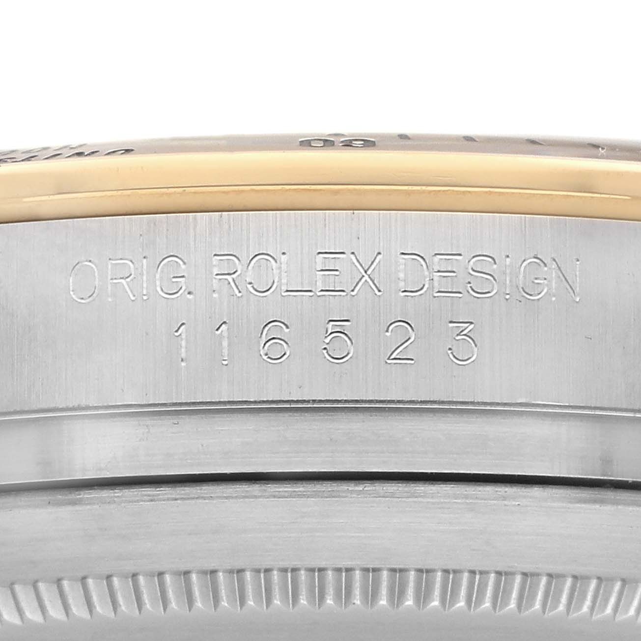 The image shows a close-up of the side of a Rolex Daytona 116523 Men's Steel and Gold (two tone) Silver Dial, highlighting the engraved model number.