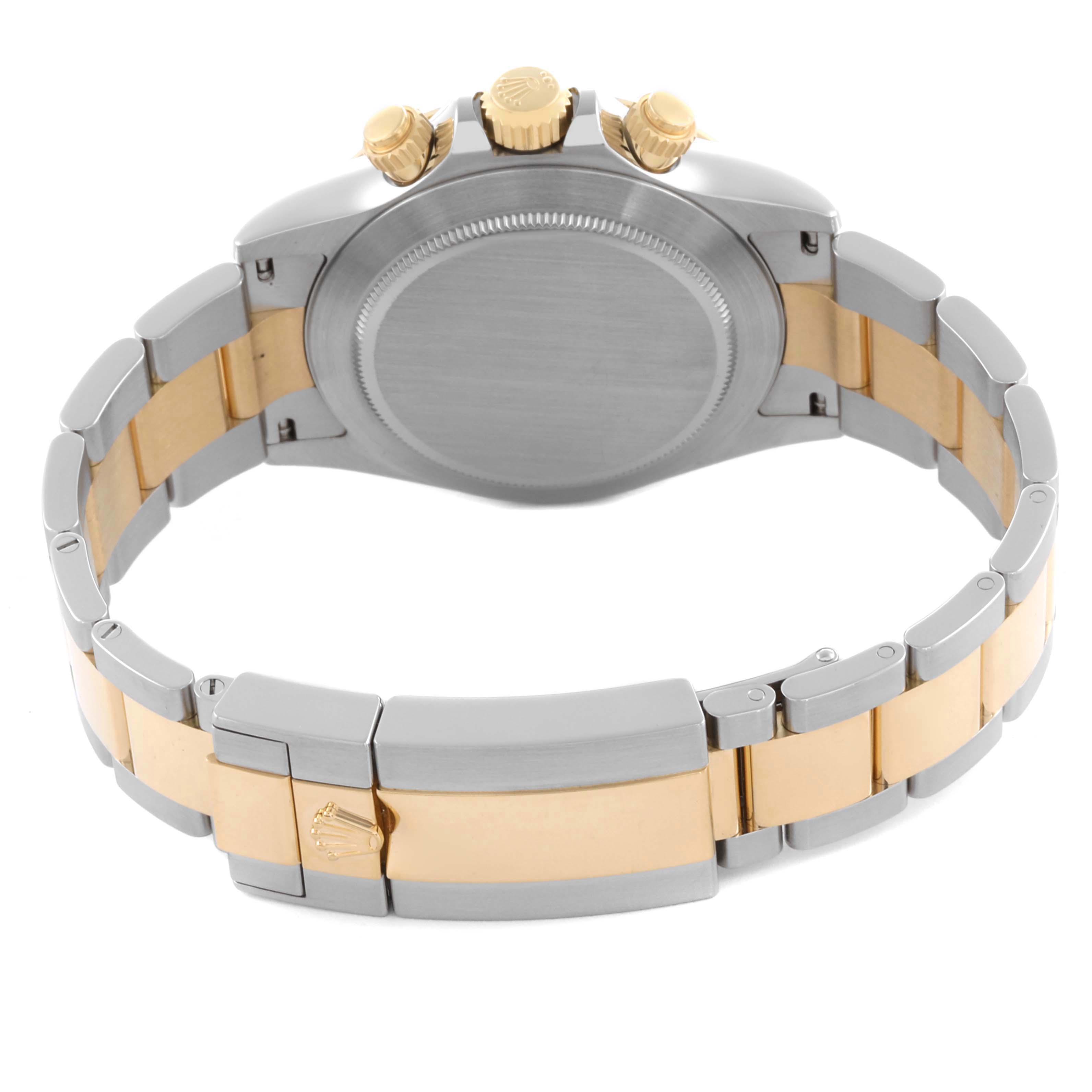 The image shows the back and side of a Rolex Daytona 116503 Men's Steel and Gold (two tone) White Dial 116503 Men's Steel and Gold (two tone) White Dial, highlighting its case, crown, and two-tone bracelet.