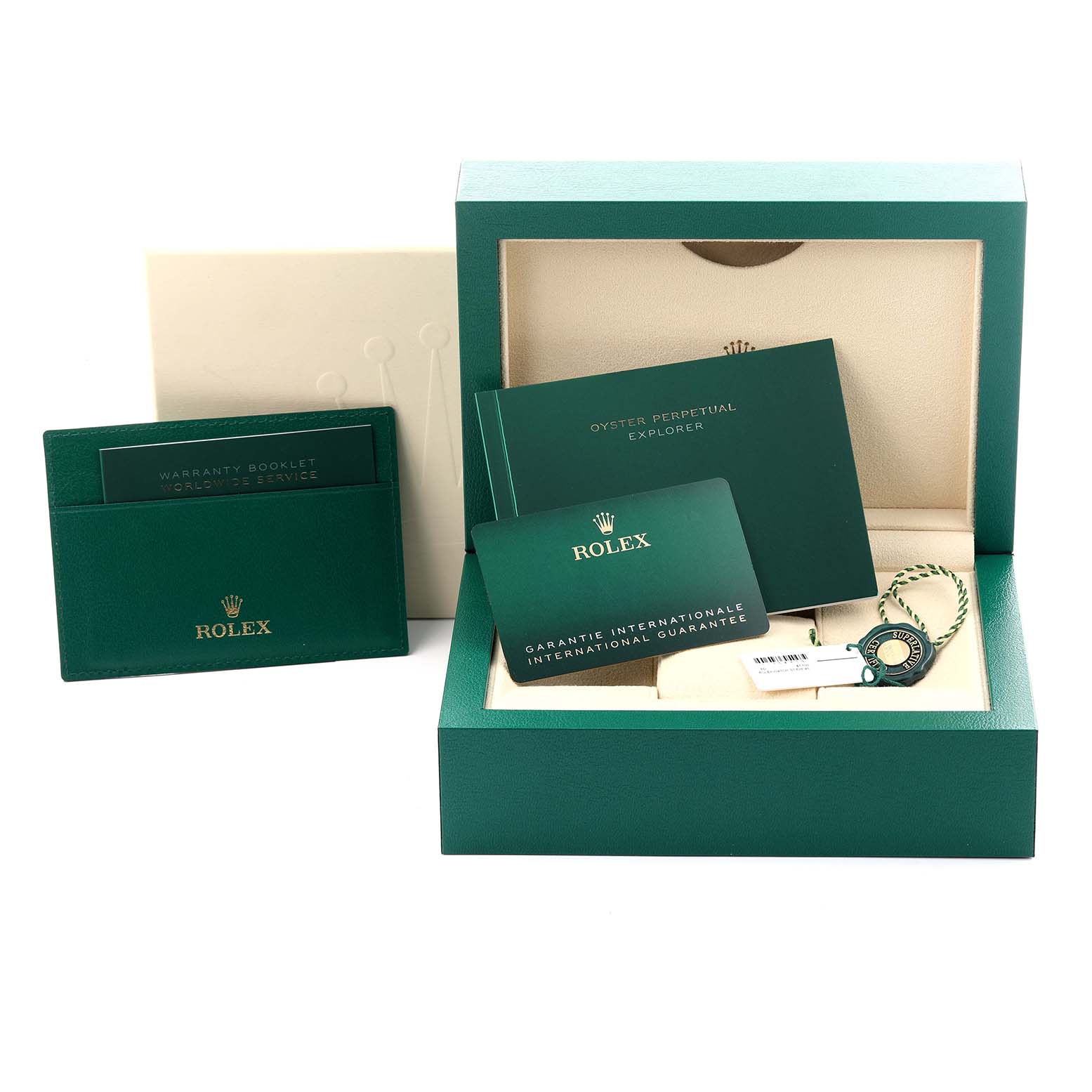 The image shows the packaging and accessories for a Rolex Explorer 224270 Men's Stainless Steel Black Dial 224270 Men's Stainless Steel Black Dial, including manuals, warranty card, and a green box.