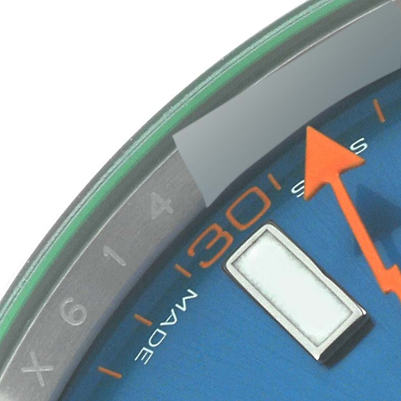 The image shows a close-up angle of the Rolex Milgauss 116400GV Men's Stainless Steel Blue Dial 116400GV Men's Stainless Steel Blue Dial watch, highlighting the hour markers, orange seconds hand, and the minute markers.