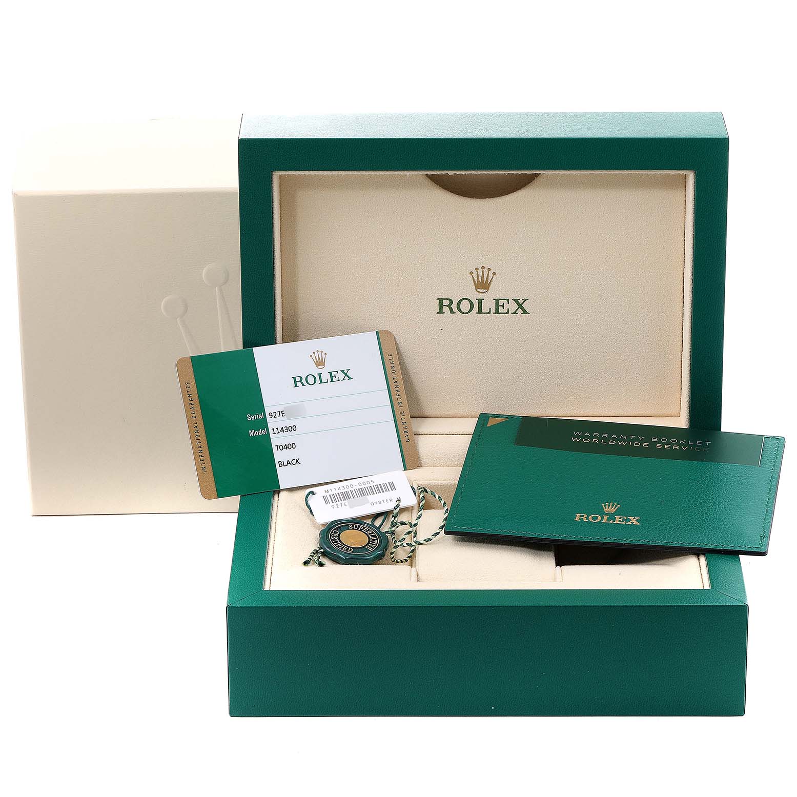 The image shows the packaging, warranty card, hang tag, and booklet for a Rolex Oyster Perpetual 114300 Men's Stainless Steel Black Dial 114300 Men's Stainless Steel Black Dial watch.