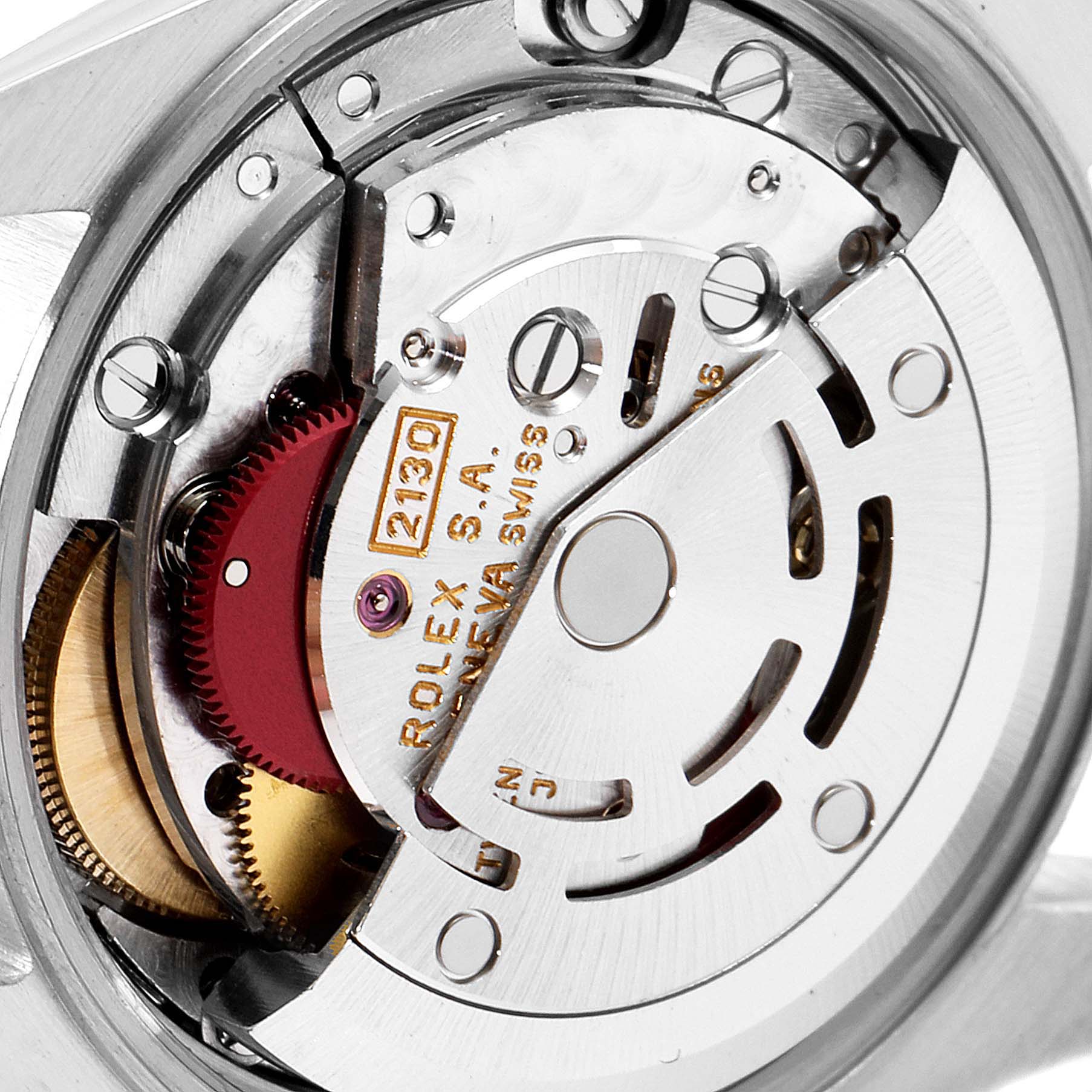 This image shows the intricate internal mechanism of the Rolex Oyster Perpetual 67193 Women
s Steel and Gold (two tone) Champagne Dial 67193 Women
s Steel and Gold (two tone) Champagne Dial watch from a close-up, angled view focusing on its movement.
