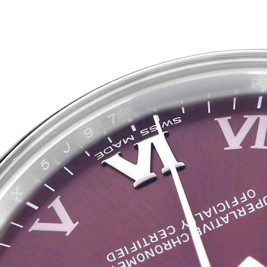 The image shows a close-up of the dial and bezel of a Rolex Mid-Size 177200 Women's Stainless Steel Purple Dial model, highlighting the Roman numerals and text.