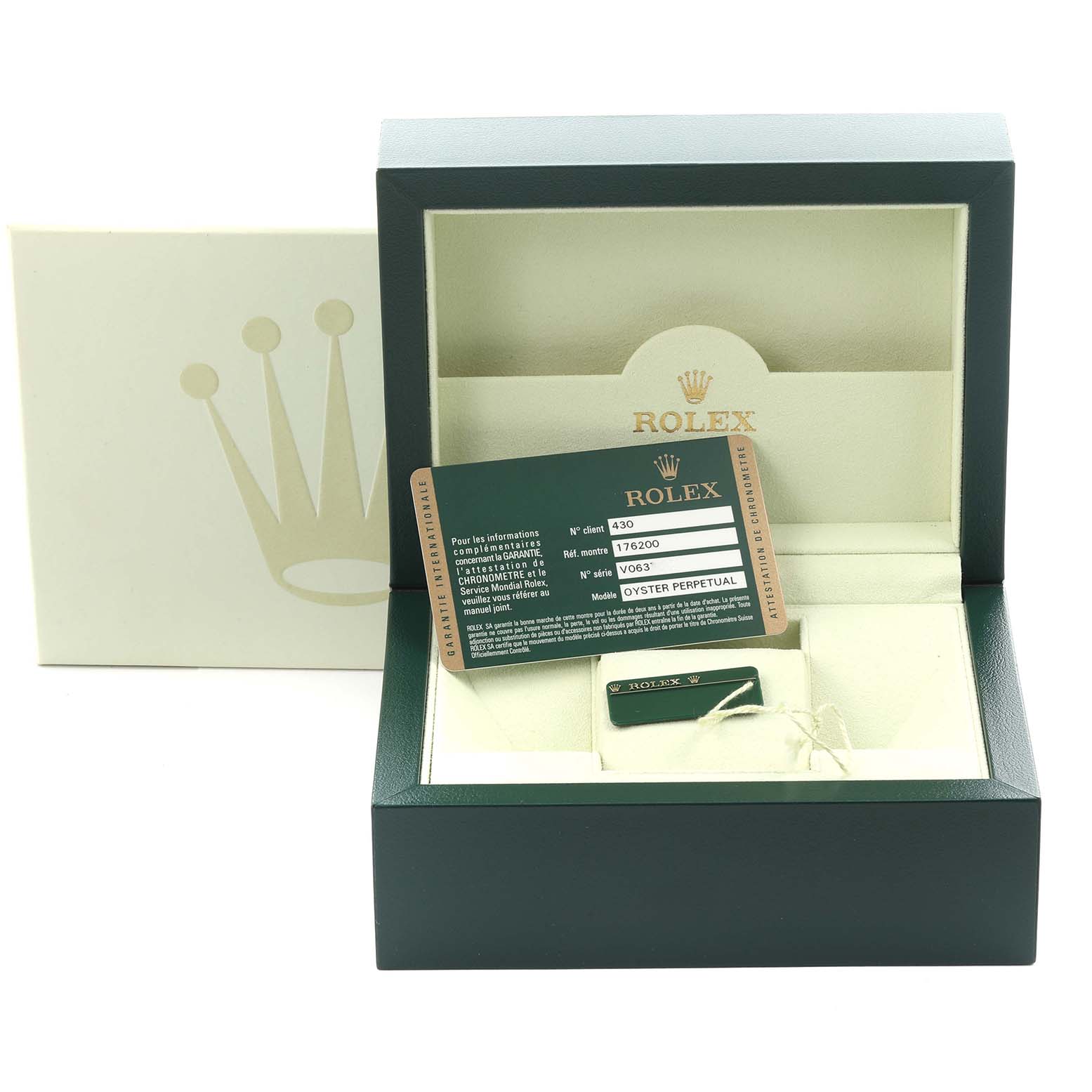 The image shows a Rolex Oyster Perpetual 176200 Women's Stainless Steel Silver Dial 176200 Women's Stainless Steel Silver Dial watch box with a warranty card and a tag inside, viewed from the front.