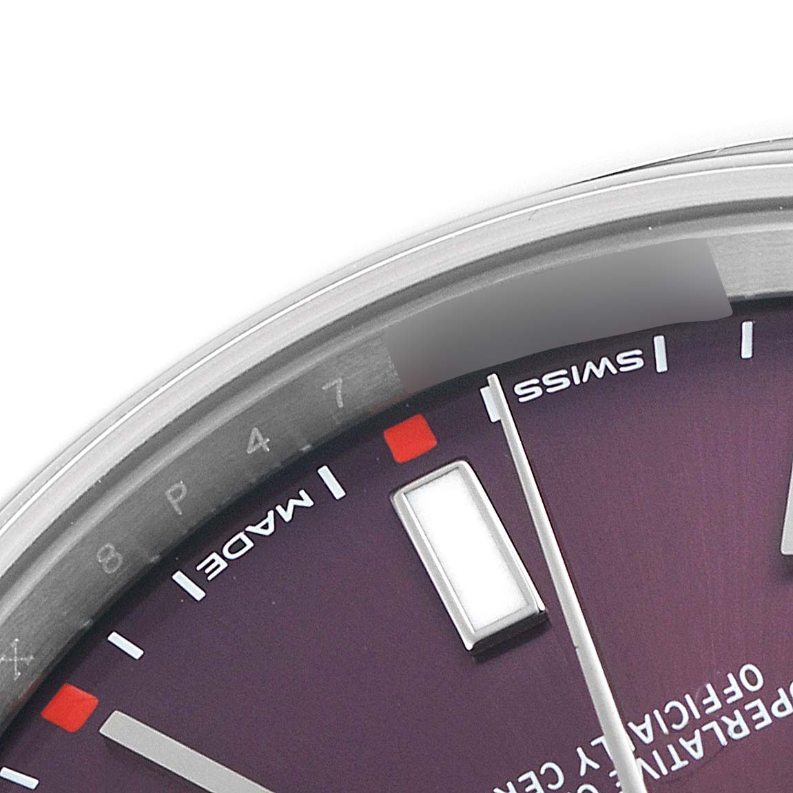 The image shows a close-up of the dial and part of the case of a Rolex Oyster Perpetual 114300 Men's Stainless Steel Burgundy Dial 114300 Men's Stainless Steel Burgundy Dial watch.