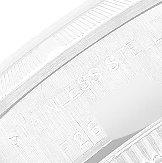This close-up image shows the edge and part of the engraved case back of a Rolex Oyster Perpetual 76030 Women's Stainless Steel Pink Dial 76030 Women's Stainless Steel Pink Dial watch.