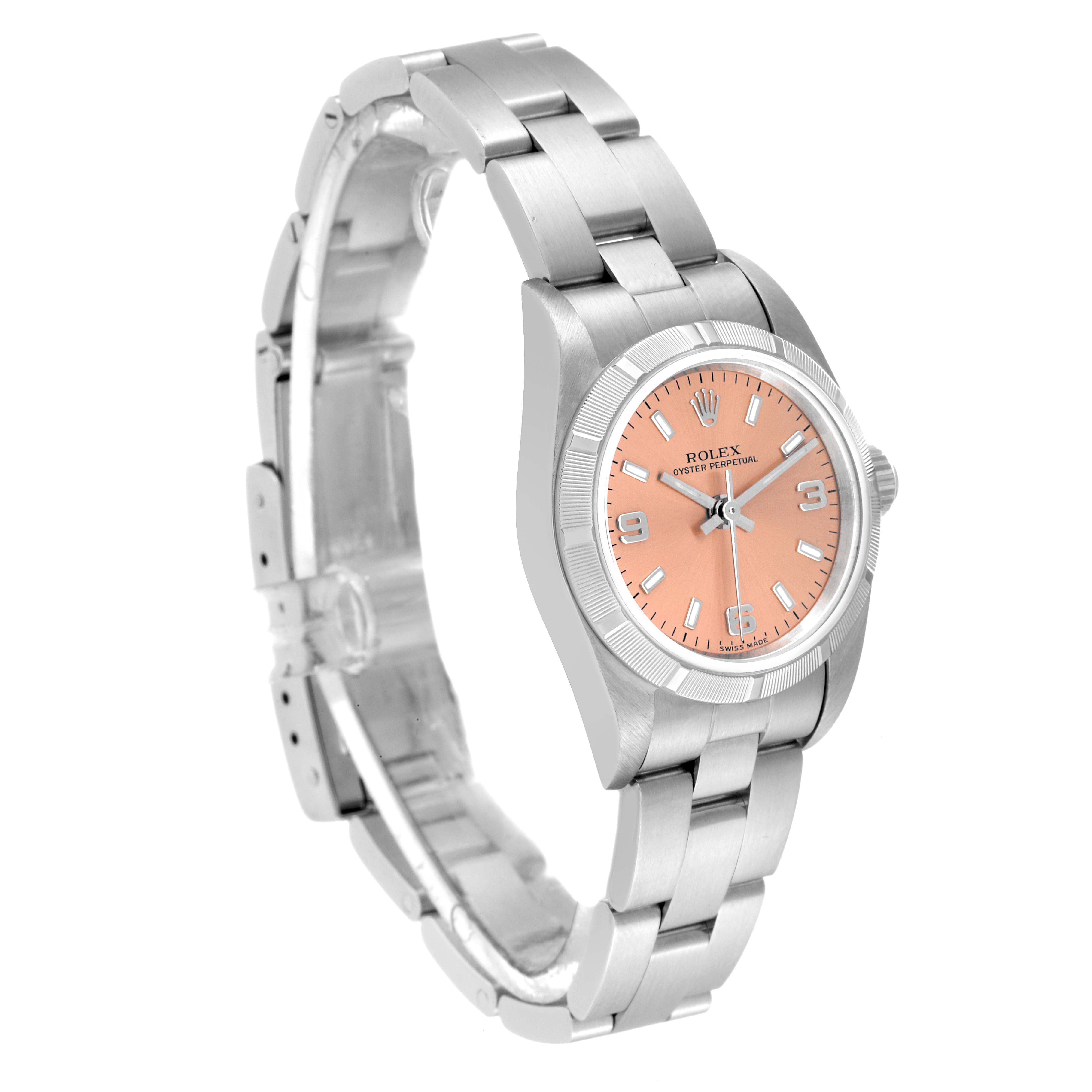 This image shows a Rolex Oyster Perpetual 76030 Women's Stainless Steel Pink Dial 76030 Women's Stainless Steel Pink Dial watch from a three-quarter angle, highlighting its pink dial and stainless steel bracelet.