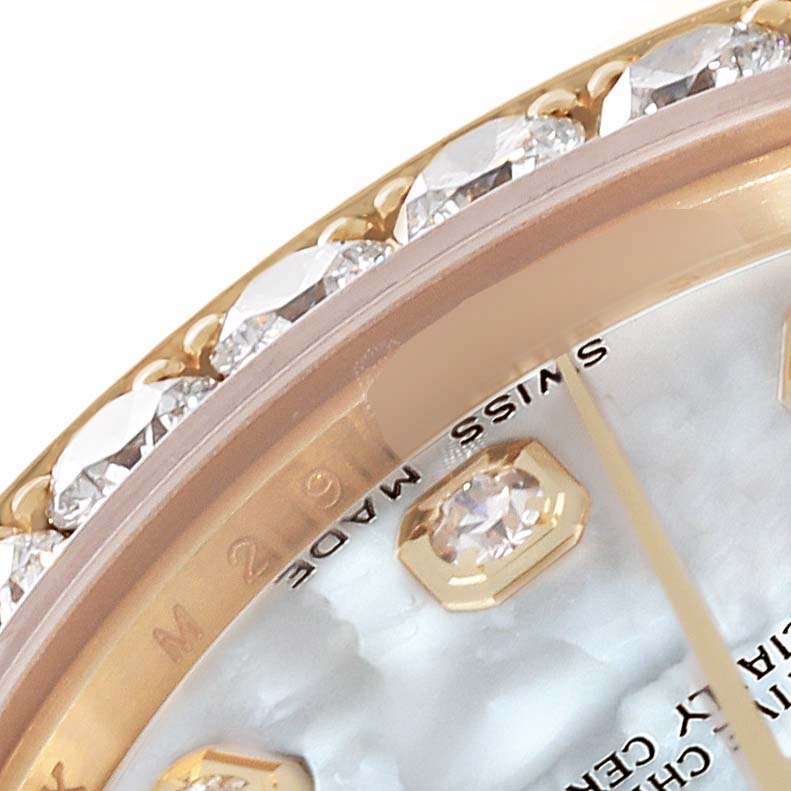 This close-up image of the Rolex Pearlmaster 81158 Women's Yellow Gold Mother of Pearl Dial 81158 Women's Yellow Gold Mother of Pearl Dial watch showcases the diamond-set bezel and part of the dial with diamond hour markers.