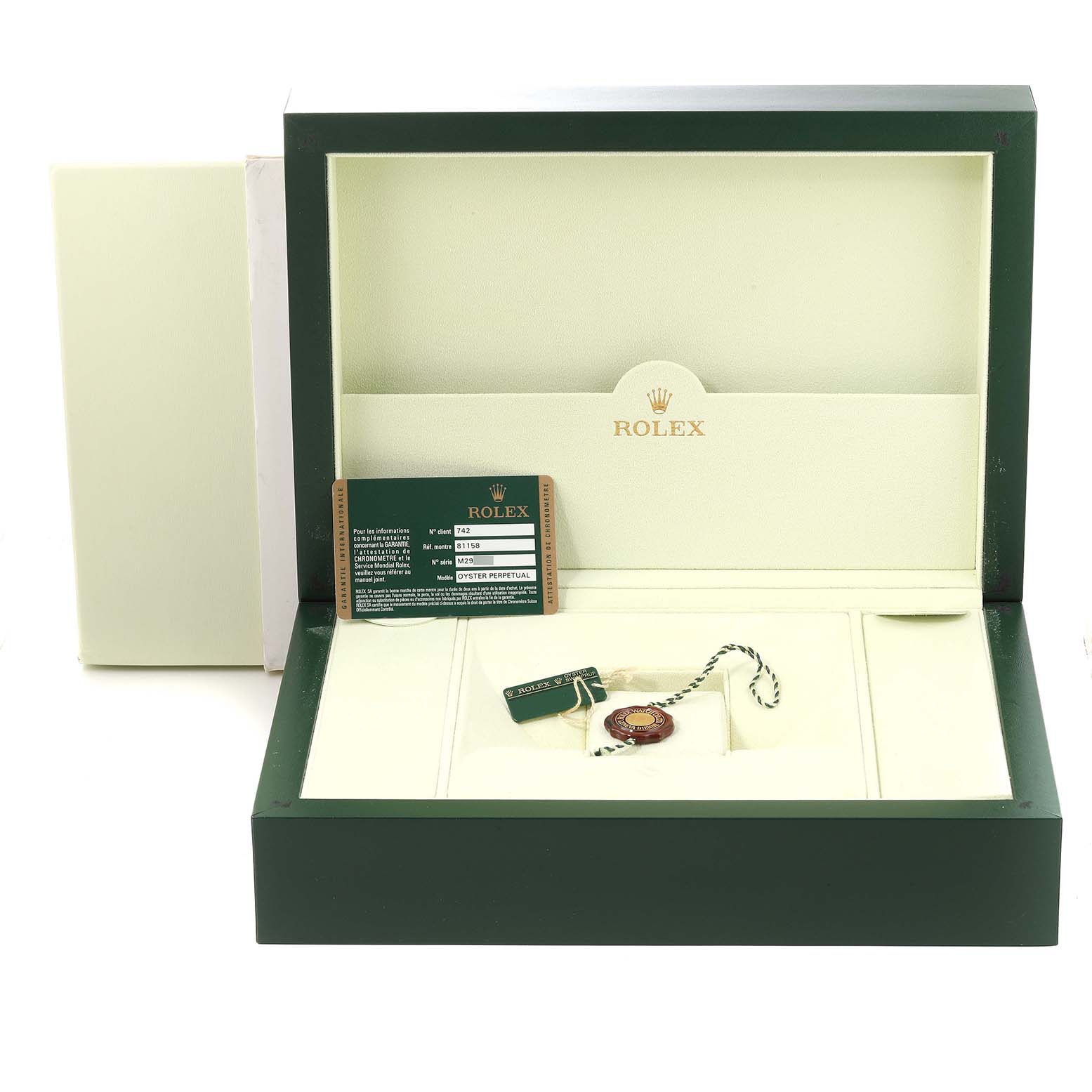 The image shows an open Rolex Pearlmaster 81158 Women's Yellow Gold Mother of Pearl Dial 81158 Women's Yellow Gold Mother of Pearl Dial watch box containing tags and an authenticity card.