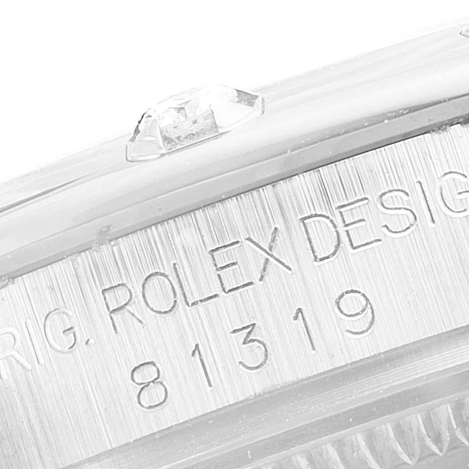 This image shows a close-up of the model and serial number engravings on the side of the Rolex Pearlmaster 81319 Women's White Gold Mother of Pearl Dial 81319 Women's White Gold Mother of Pearl Dial watch.