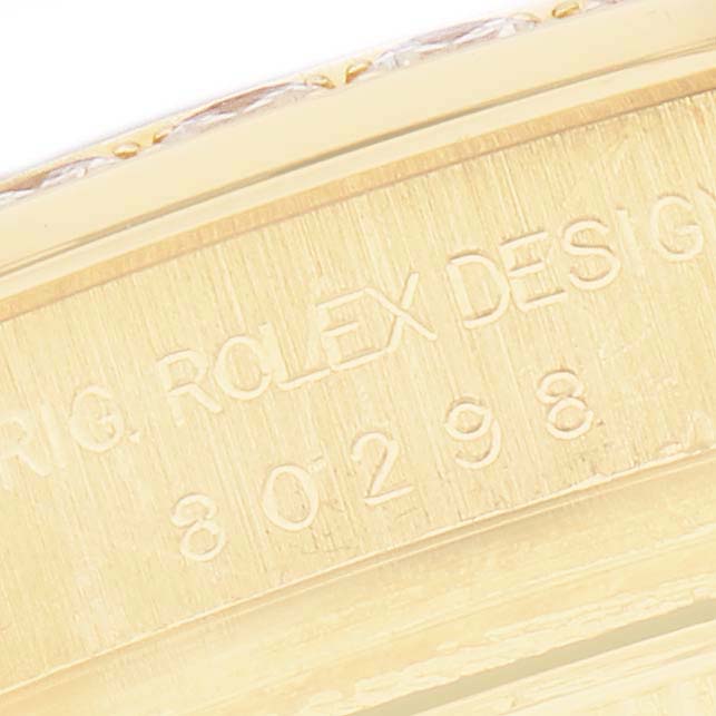 The image shows a close-up of the engraved side of the Rolex Pearlmaster 80298 Women's Yellow Gold Black Dial watch case.