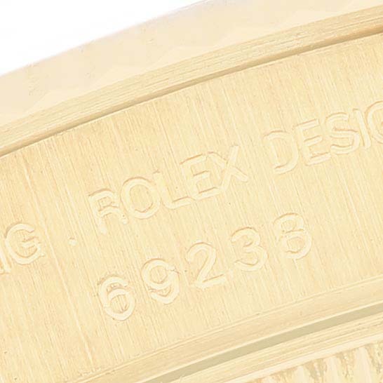 This image shows a close-up of the inner case of a Rolex President 69238 Women's Yellow Gold Champagne Dial 69238 Women's Yellow Gold Champagne Dial model watch with the serial number "69238."