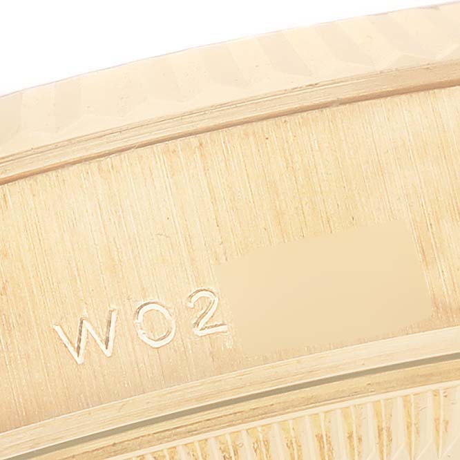 This image shows a close-up view of the casing and engraved serial number of a Rolex President 69238 Women's Yellow Gold Champagne Dial 69238 Women's Yellow Gold Champagne Dial model watch.