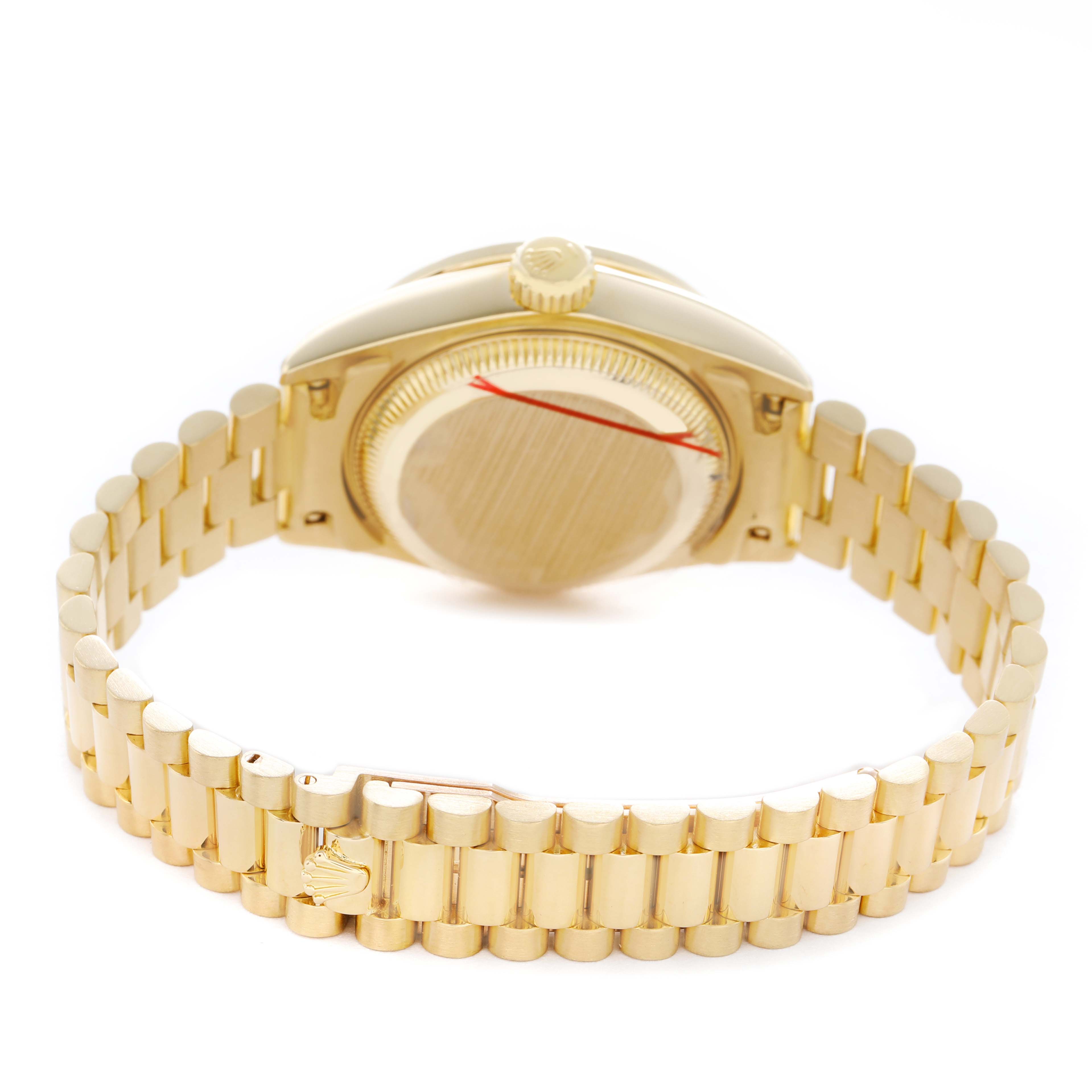 The image shows the back case and bracelet of a Rolex President 69158 Women's Yellow Gold Champagne Dial model watch from a rear angle.