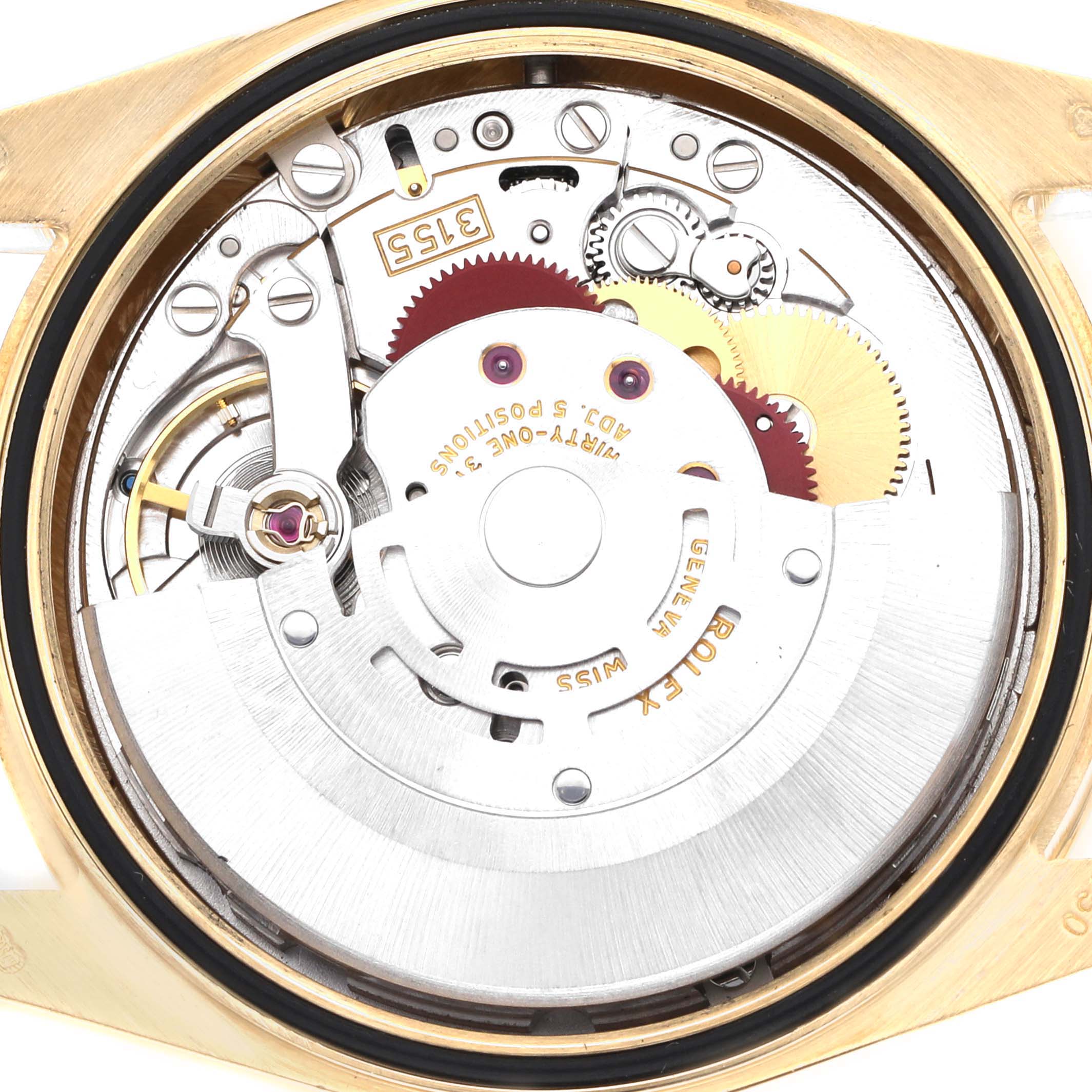 The image shows the internal mechanism of a Rolex President 118348 Men's Yellow Gold Champagne Dial watch from a top-down angle, highlighting gears and the movement.