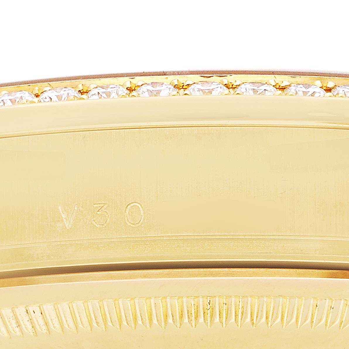 The image shows a close-up of the bezel and side of a Rolex President 118348 Men's Yellow Gold Champagne Dial model with diamonds, highlighting its detailed engraving.