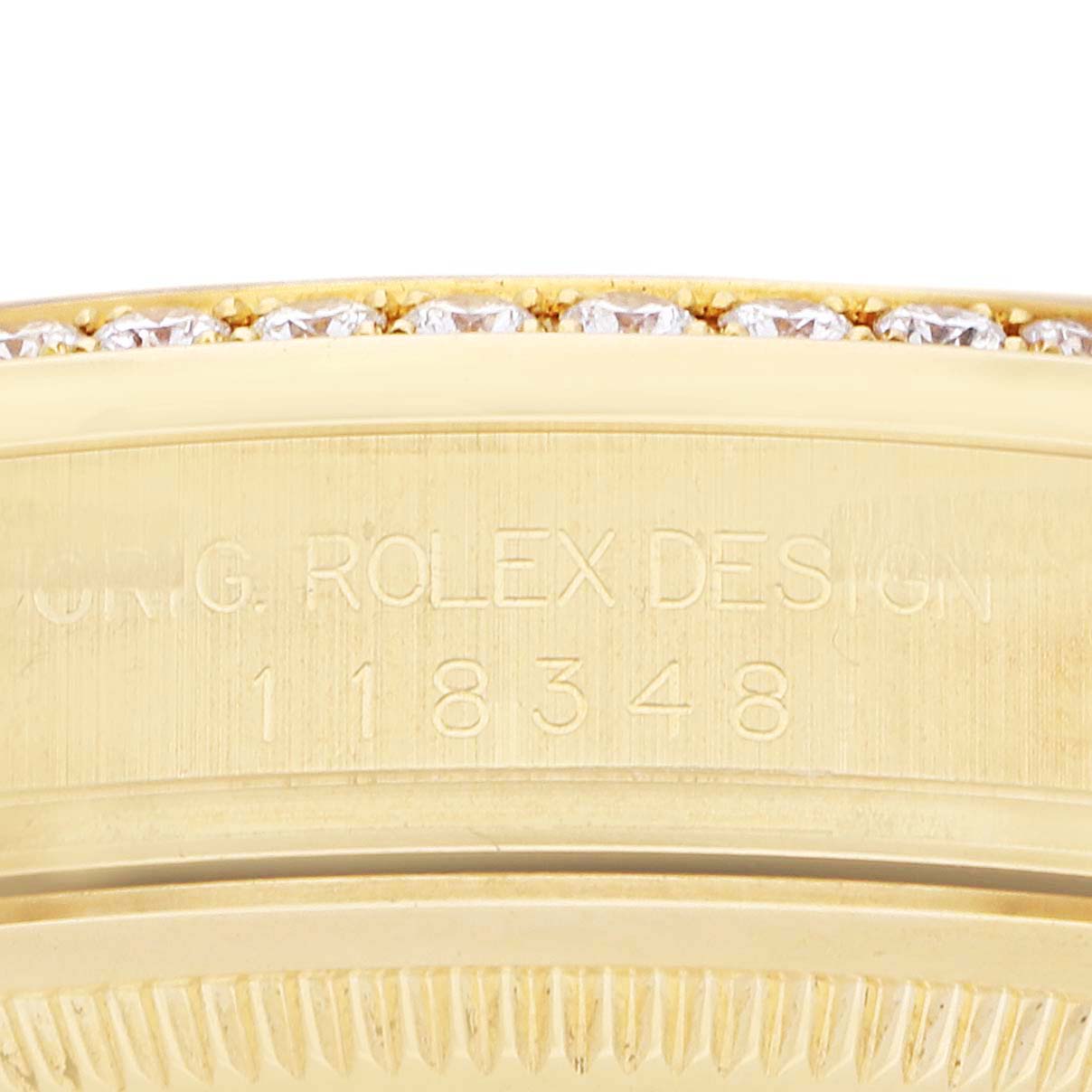 The image shows the side view of a Rolex President 118348 Men's Yellow Gold Champagne Dial model, highlighting the engraved model number and diamond accents on the bezel.