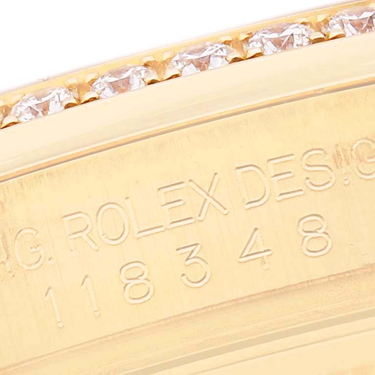 The image shows the engraved side detail of a Rolex President 118348 Men's Yellow Gold Mother of Pearl Dial model watch, featuring diamonds and the reference number.