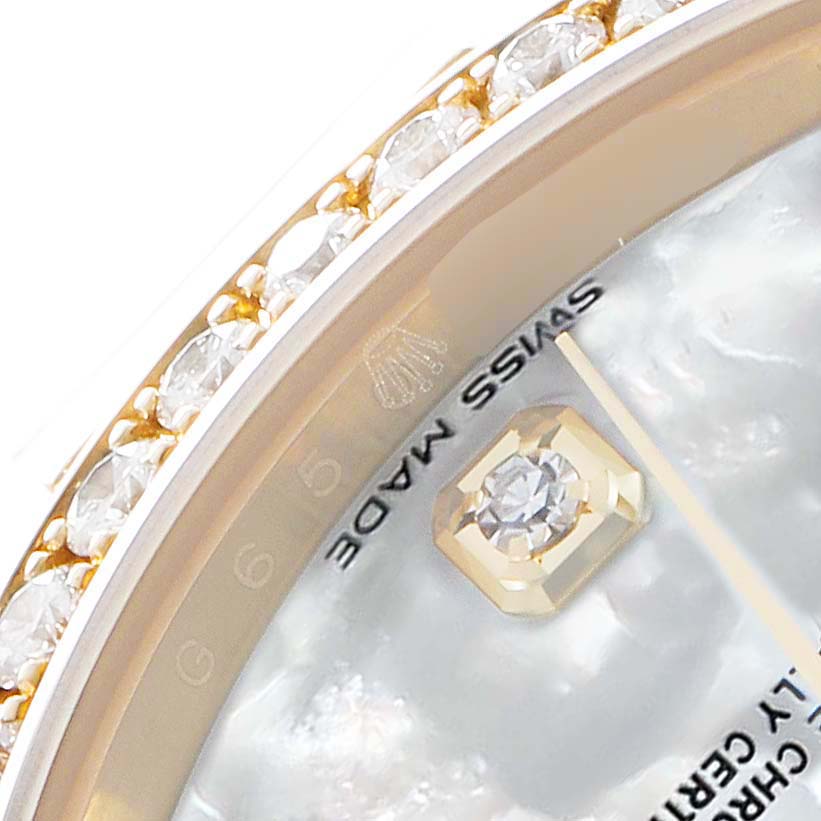 The close-up image of the Rolex President 118348 Men's Yellow Gold Mother of Pearl Dial watch shows part of the diamond-set bezel and the "Swiss Made" text on the dial.