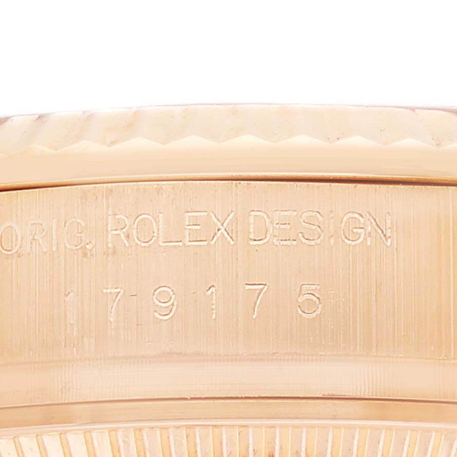 The image shows a close-up of the side of a Rolex President 179175 Women's Rose Gold Pink Dial watch, highlighting the engraved numbers.