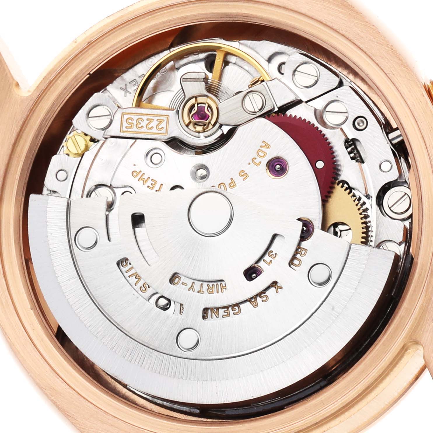 The image shows the intricate movement mechanism of a Rolex President 179175 Women's Rose Gold Pink Dial model from the back, highlighting gears and components.