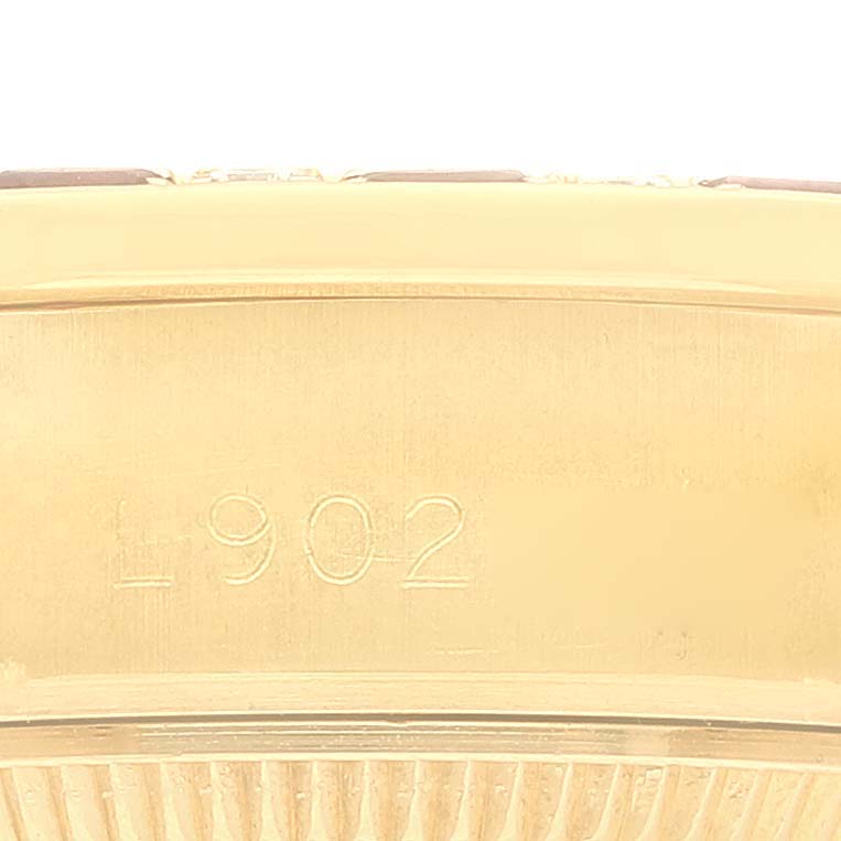 The image shows a close-up view of the side casing and part of the fluted bezel of a Rolex President 69198 Women
s Yellow Gold Champagne Dial 69198 Women
s Yellow Gold Champagne Dial model watch with "L 902" engraved.