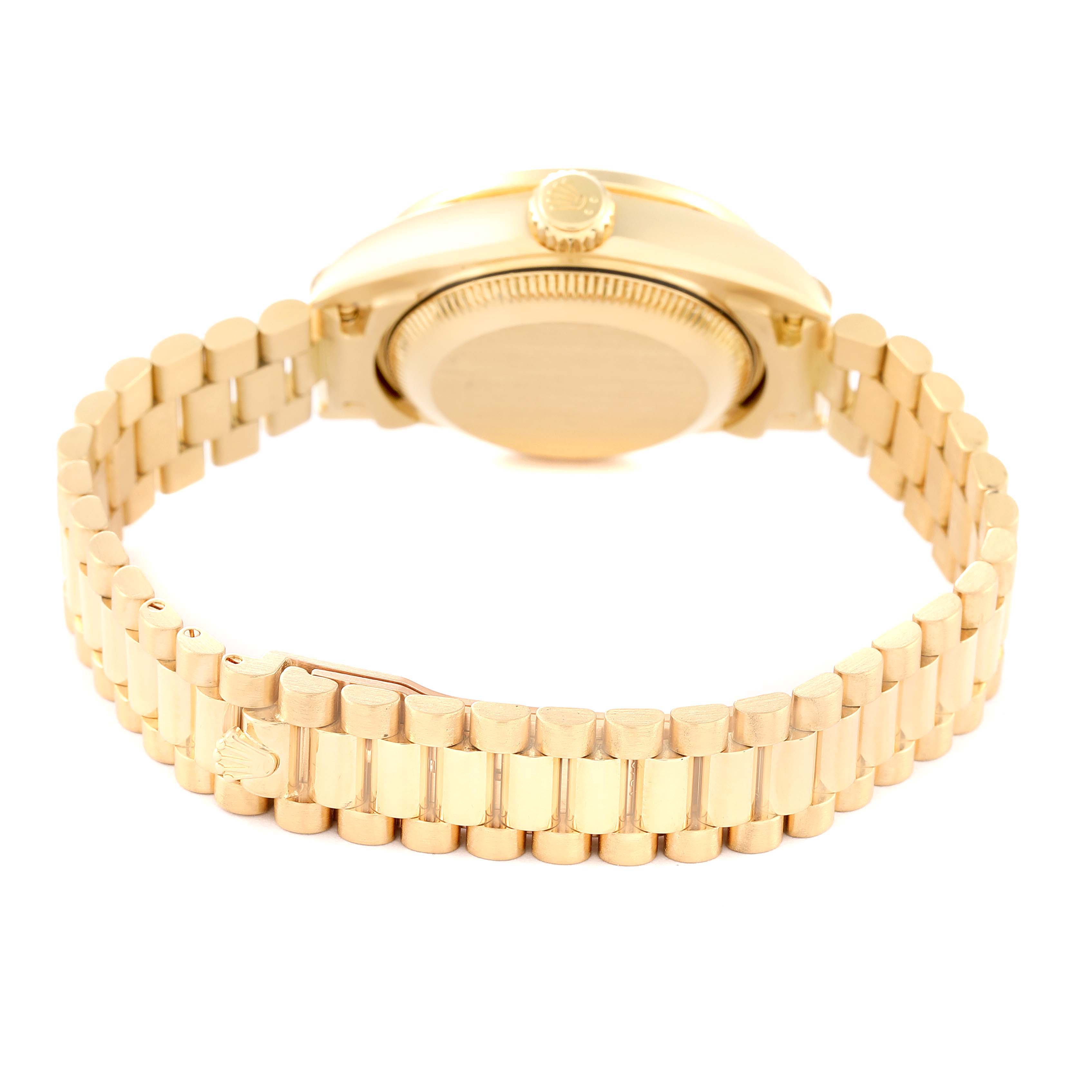 The image shows the back view of a Rolex President 69198 Women
s Yellow Gold Champagne Dial 69198 Women
s Yellow Gold Champagne Dial model watch, focusing on the bracelet and case back.