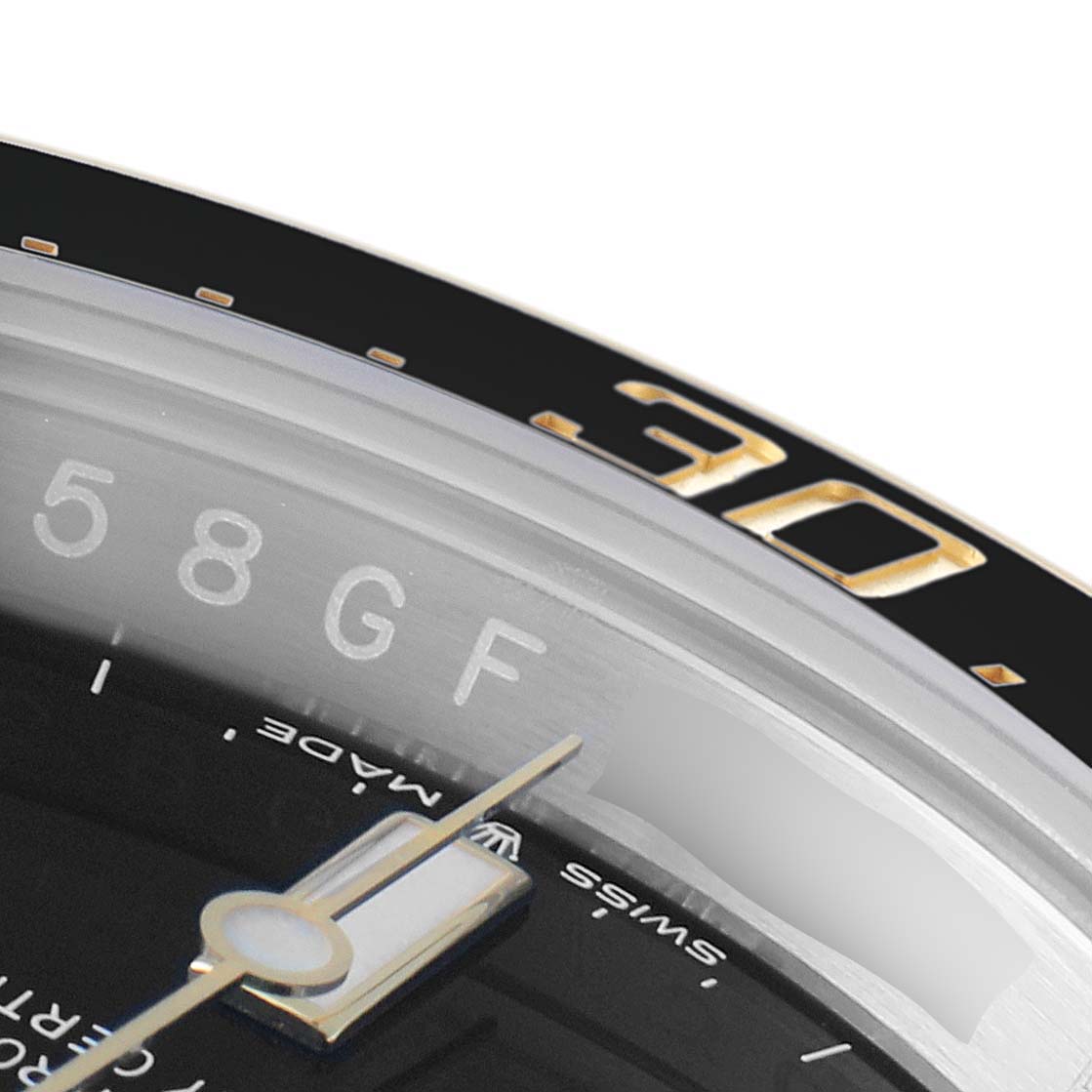The image shows a close-up of the dial and bezel of a Rolex Sea-Dweller 126603 Men's Steel and Gold (two tone) Black Dial 126603 Men's Steel and Gold (two tone) Black Dial watch, highlighting the minute hand and part of the bezel's 30 marker.