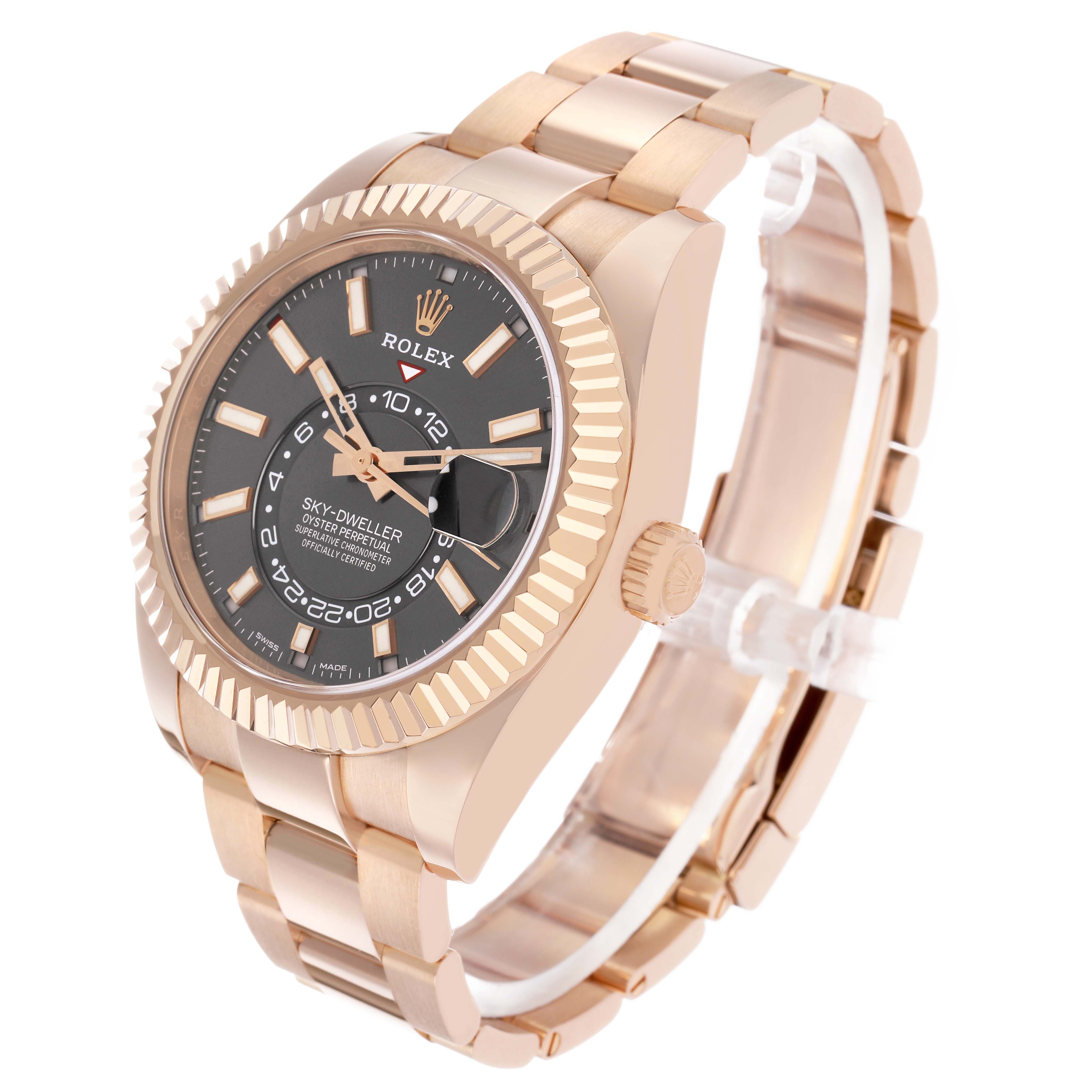 The Rolex Sky-Dweller 326935 Men's Rose Gold Grey Dial watch is shown at a three-quarter angle, displaying the dial, fluted bezel, crown, and bracelet.