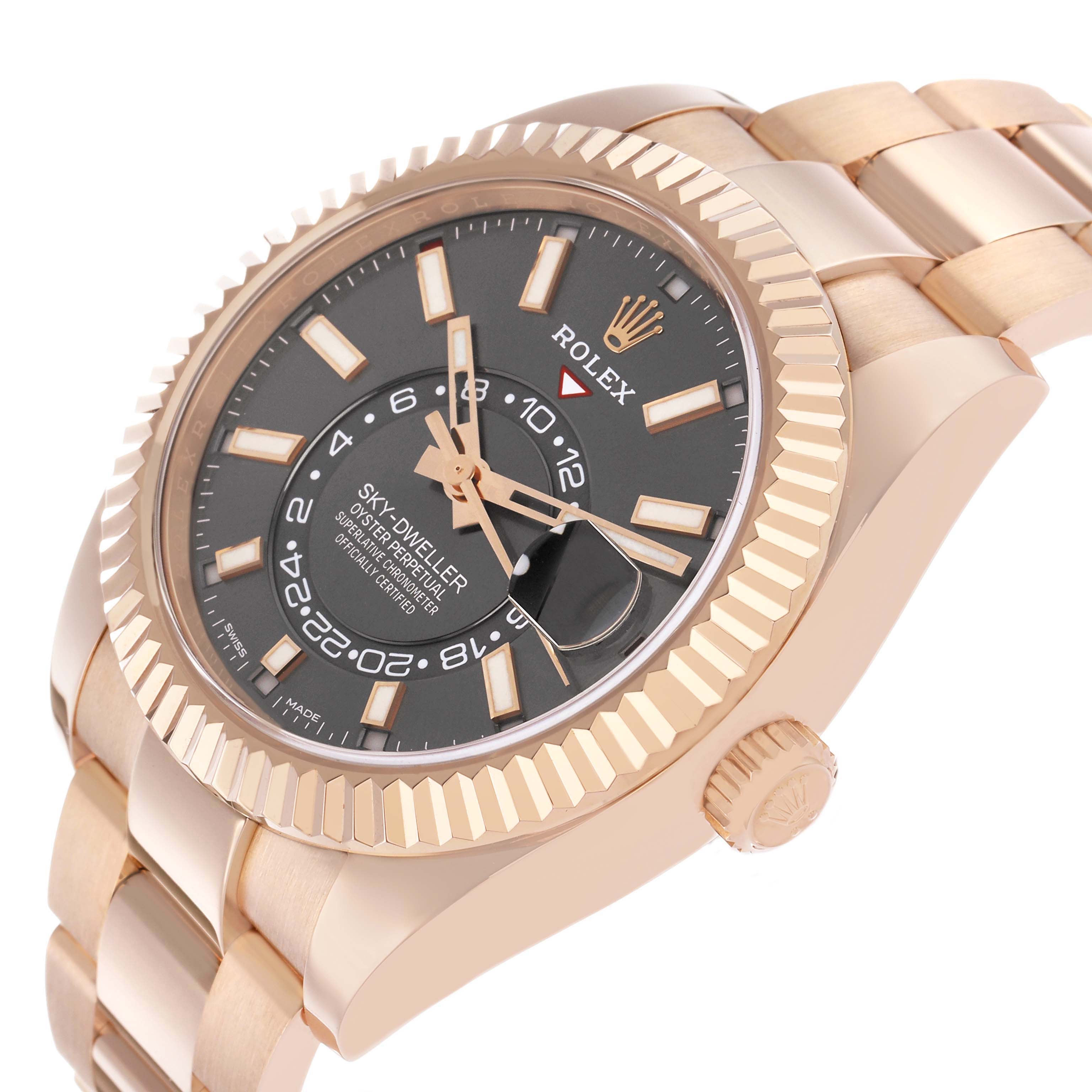 The Rolex Sky-Dweller 326935 Men's Rose Gold Grey Dial is shown at a slight angle, highlighting the dial, fluted bezel, bracelet, and crown.