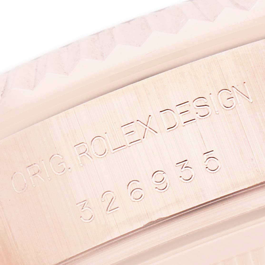The image shows a close-up of the model number engraving on the side of a Rolex Sky-Dweller 326935 Men's Rose Gold Grey Dial watch case.