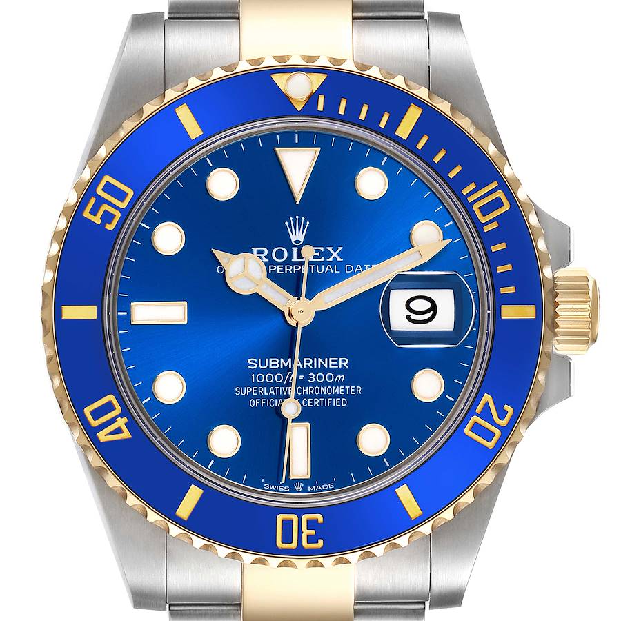 The Rolex Submariner watch is shown from a front angle, displaying the blue dial, bezel, and two-tone bracelet.