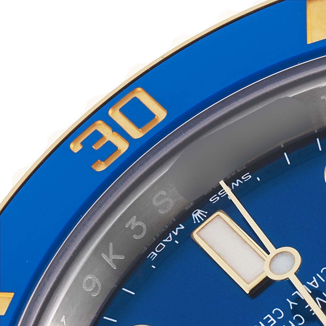 The image shows a close-up of the Rolex Submariner 126613LB Men's Steel and Gold (two tone) Blue Dial 126613LB Men's Steel and Gold (two tone) Blue Dial's blue bezel and dial, focusing on the "30" marker and watch hands.