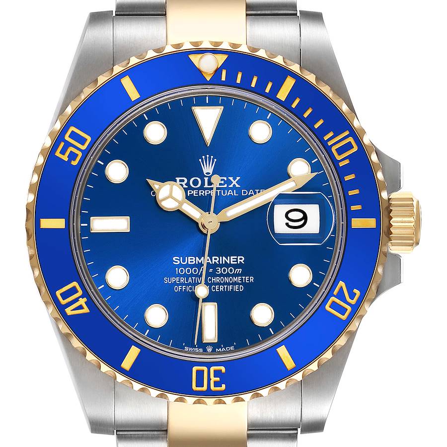 The image shows the front view of a Rolex Submariner, highlighting the blue dial and bezel, with gold accents.