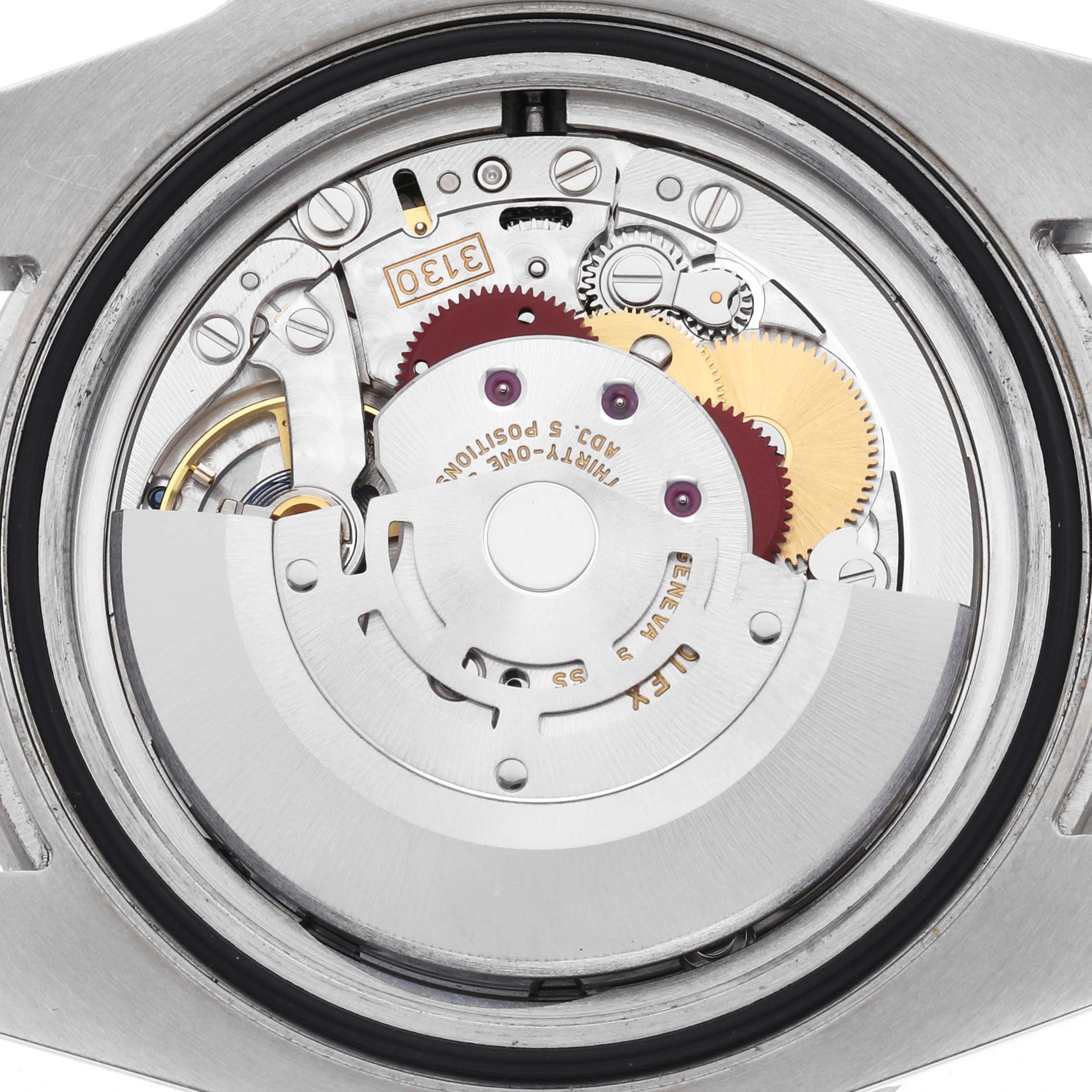 The image shows the movement of a Rolex Submariner 114060 Men's Stainless Steel Black Dial watch from a back view, highlighting gears and components.