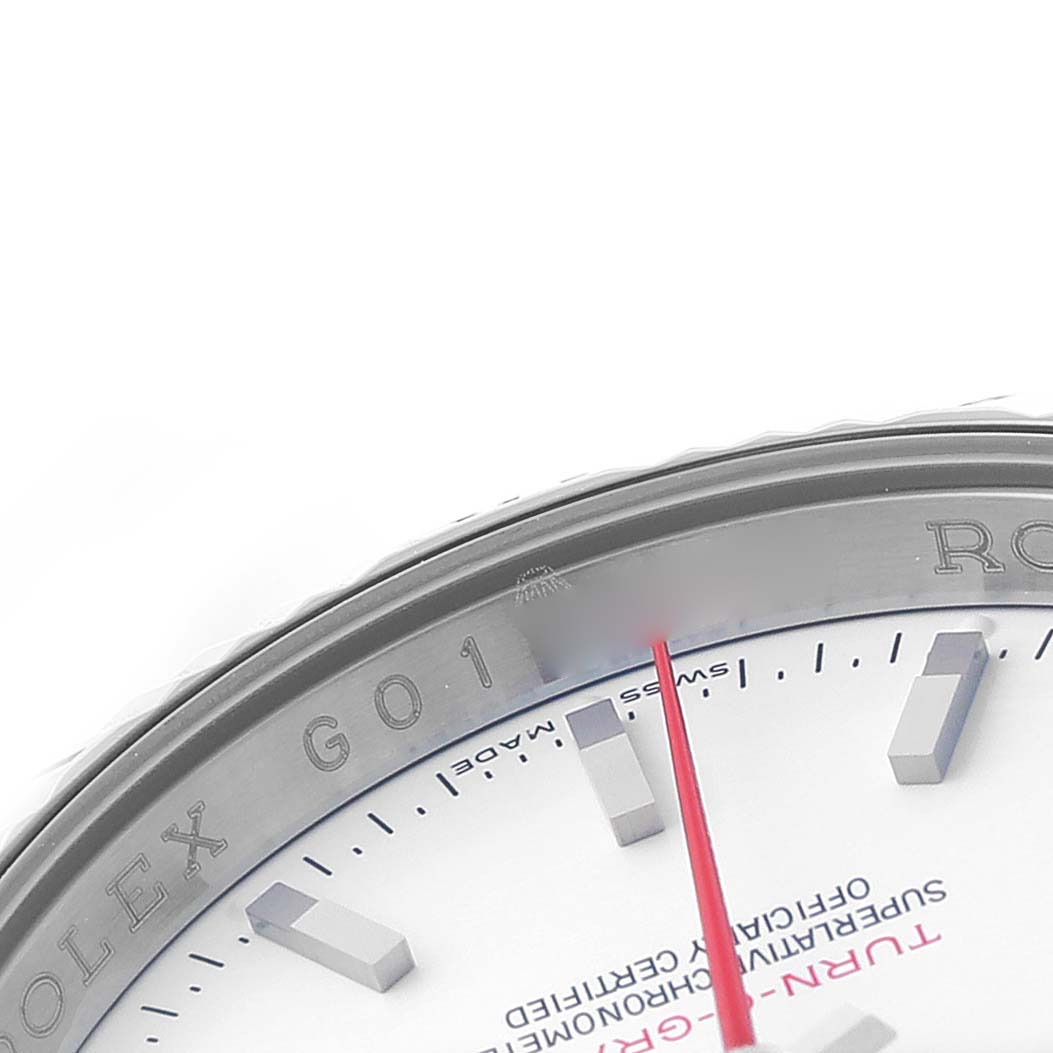 The image shows a close-up of the bezel, edge of the dial, and hour markers of the Rolex Turn-o-Graph 116264 Men's Stainless Steel White Dial watch.