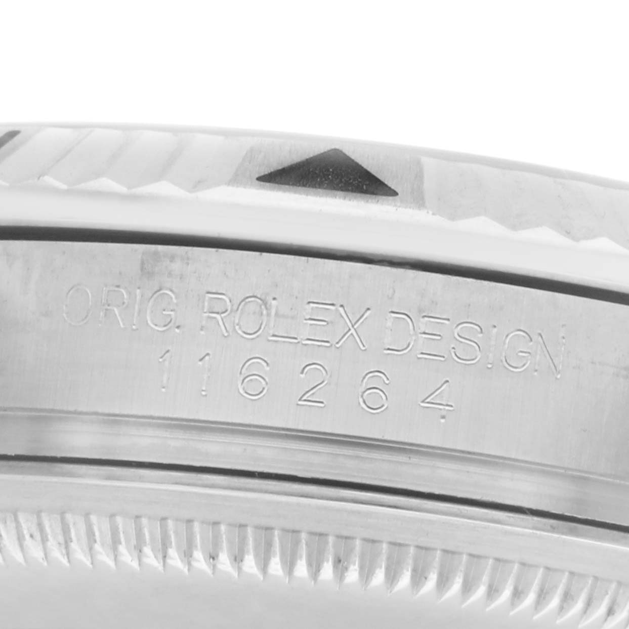 The image shows a close-up of the edge of a Rolex Turn-o-Graph 116264 Men's Stainless Steel White Dial watch, highlighting its bezel and engraved model number.